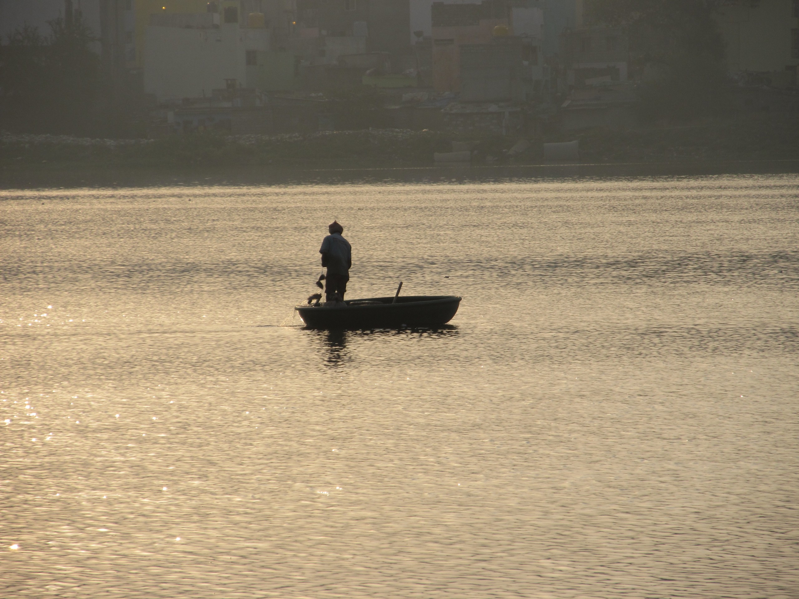 A fisherman in a boat