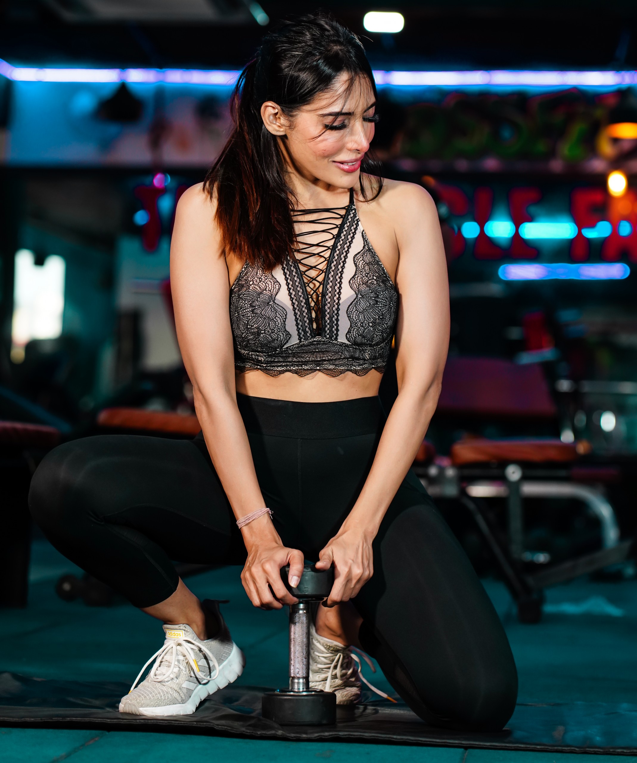 A fit girl with dumbbells