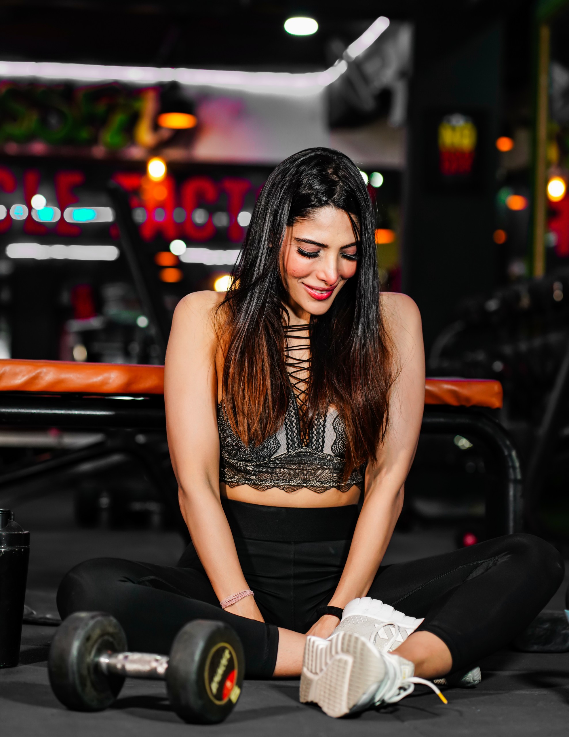 Beautiful fitness model smile in gym