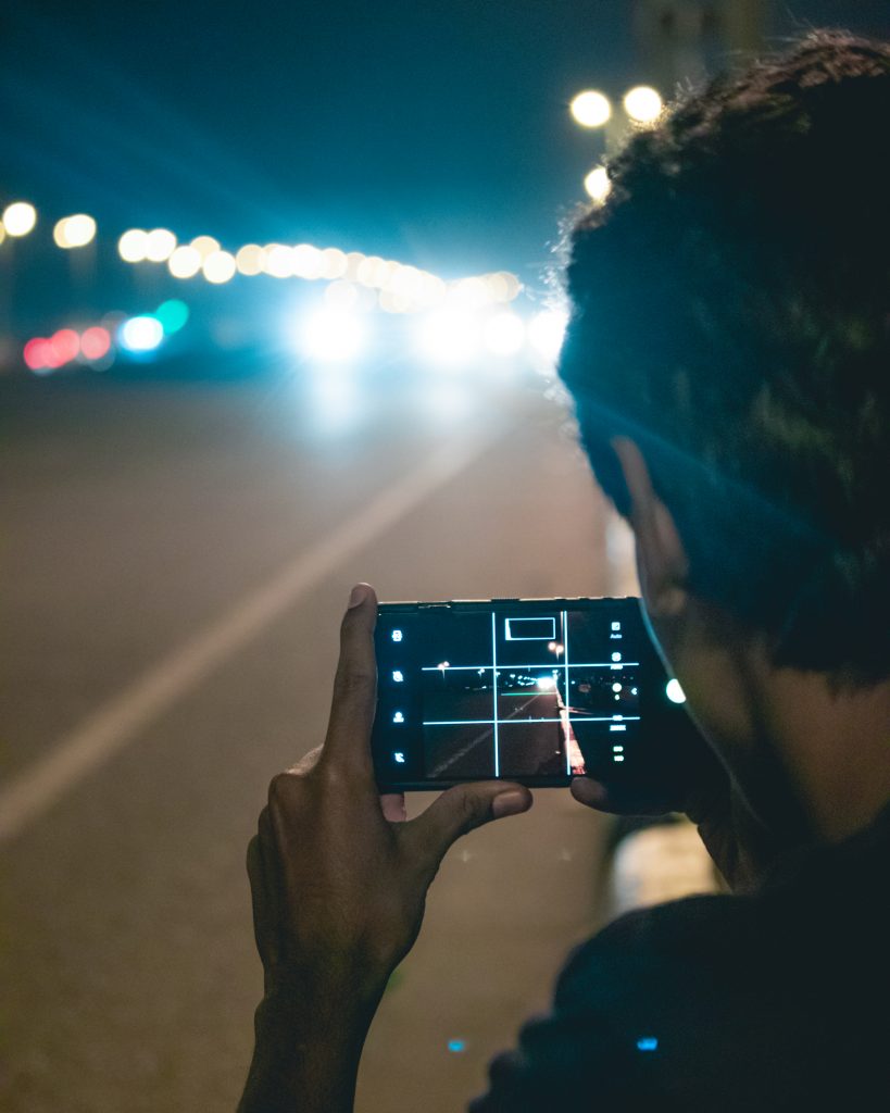 Boy taking photo of vehicles - PixaHive