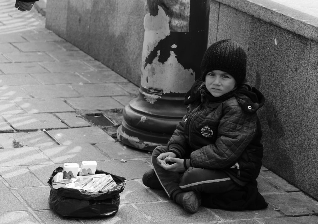 Child selling handkerchief on the street - PixaHive