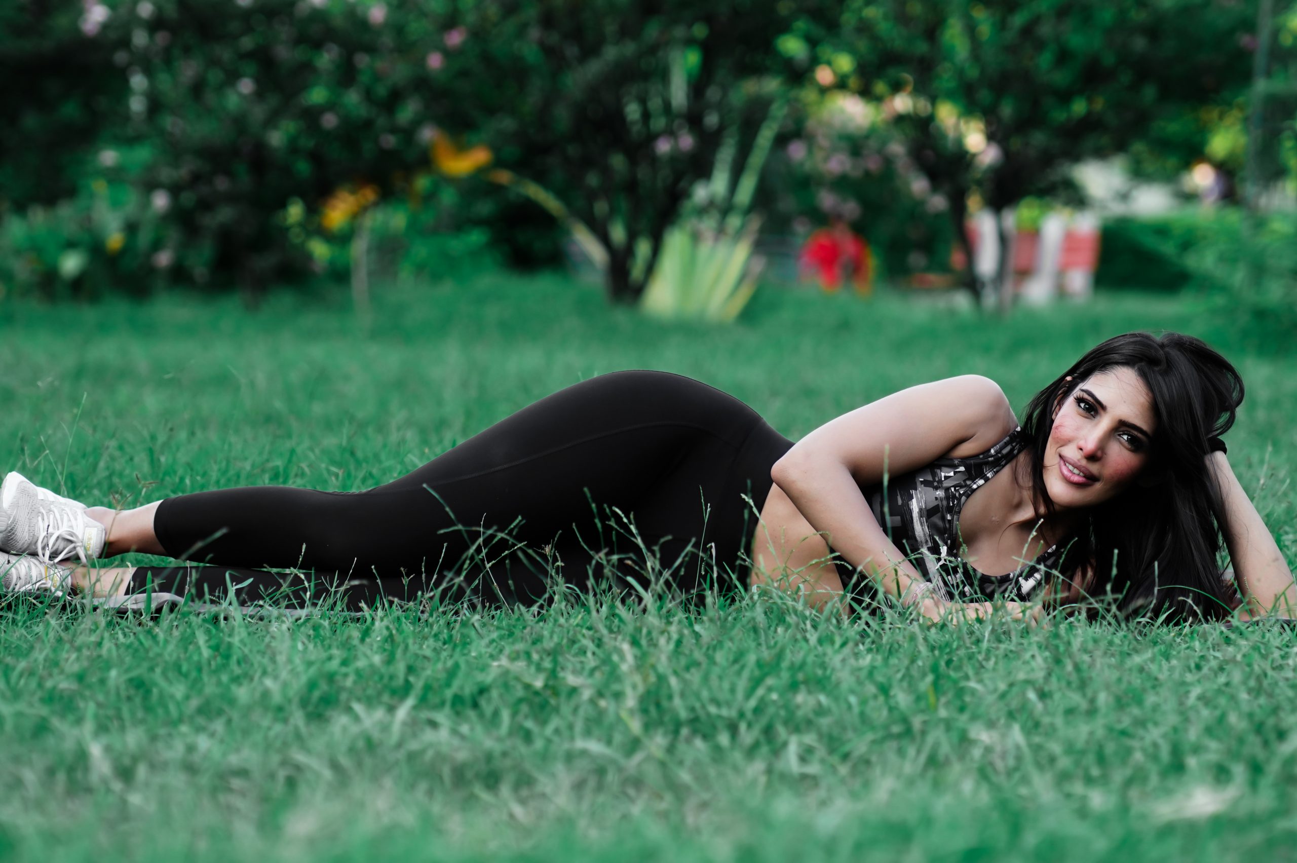 Female lying after yoga in park