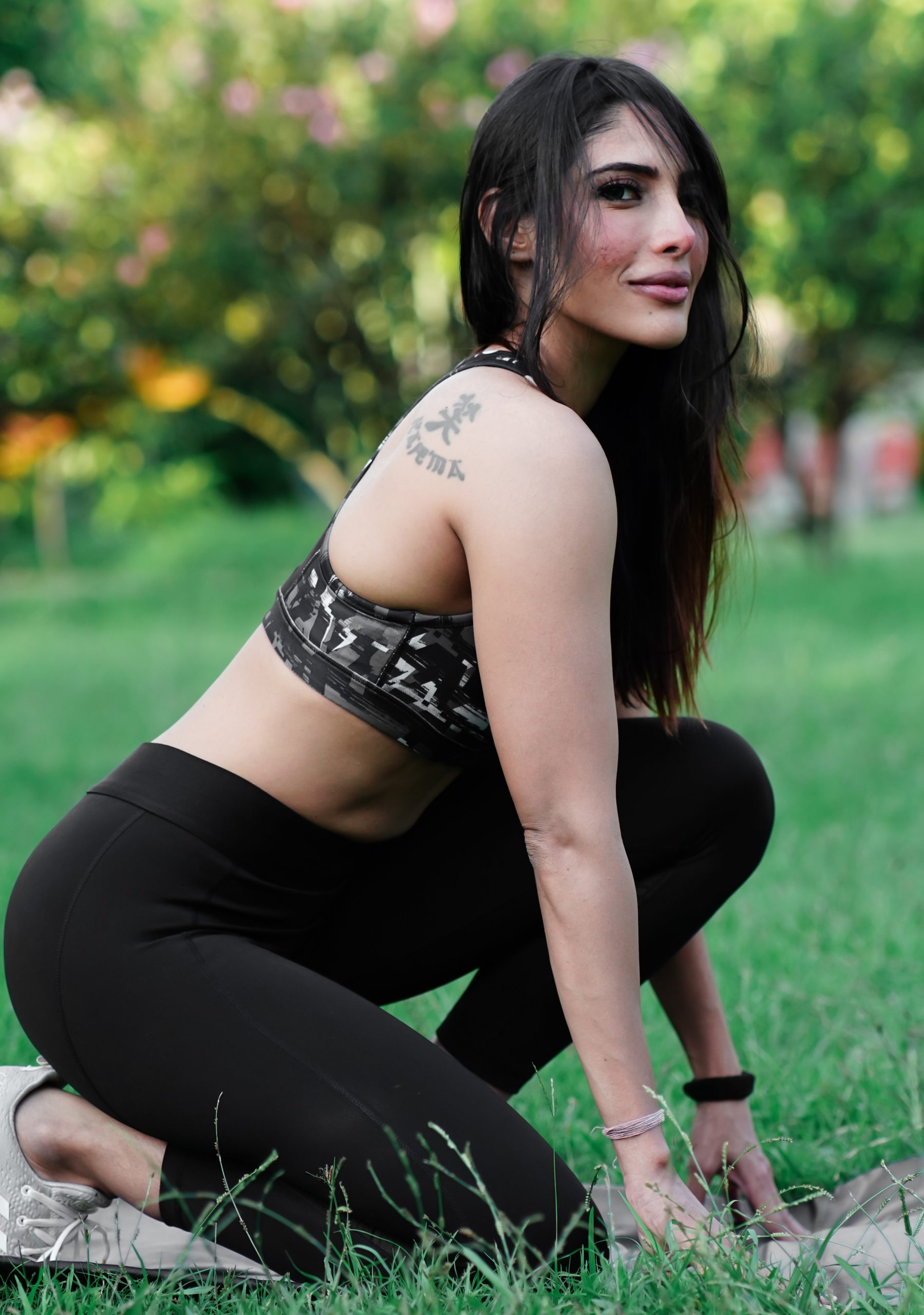 Female yoga trainer in park