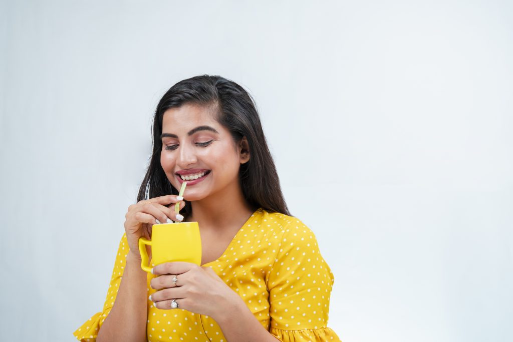 Girl happily drinking juice PixaHive