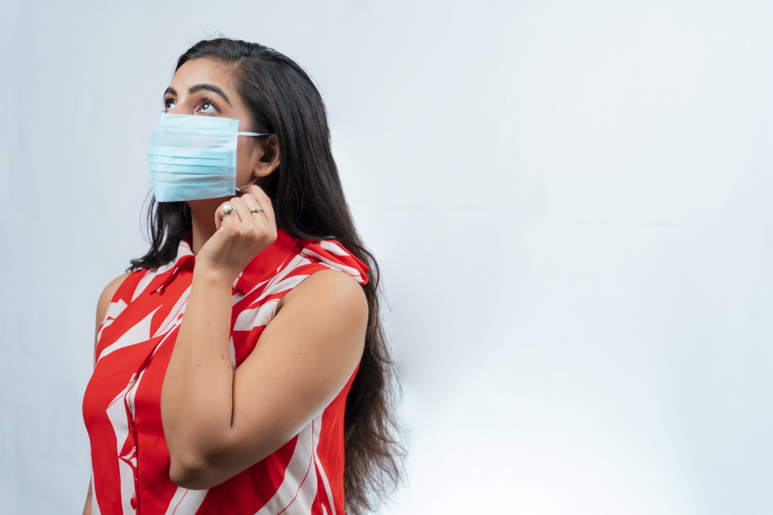 Indian girl posing with mask