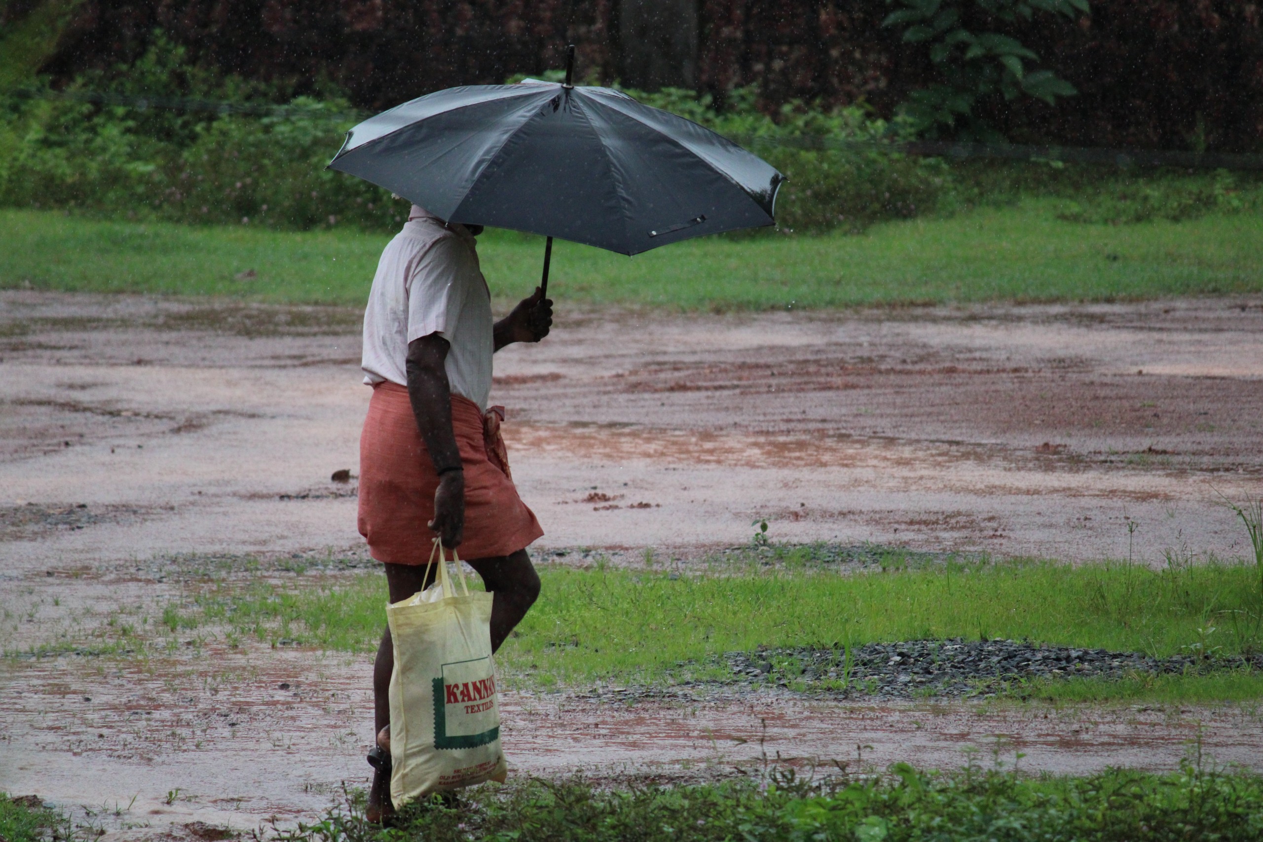 Man walking with an Umbrella