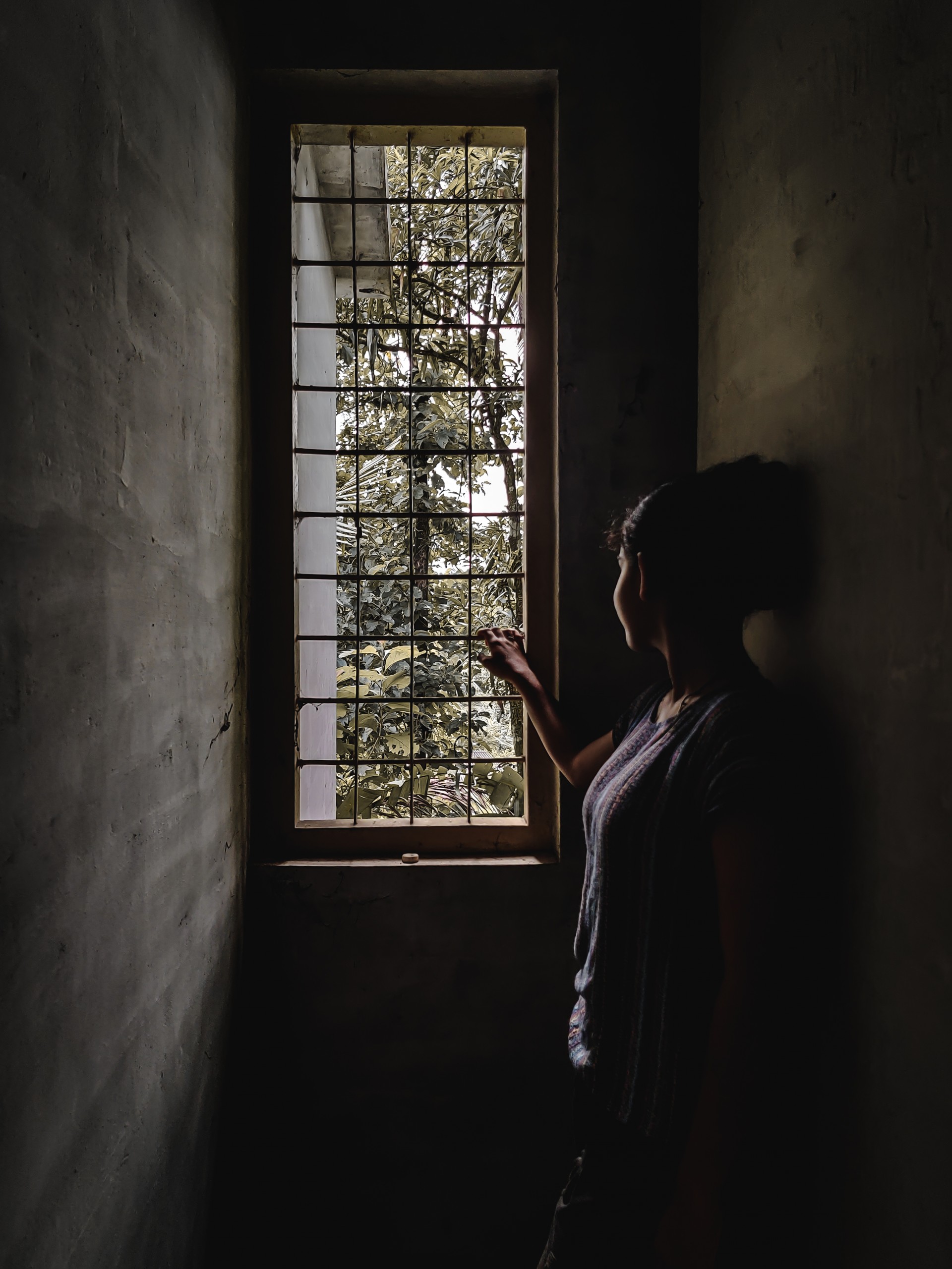 Girl looking through a window