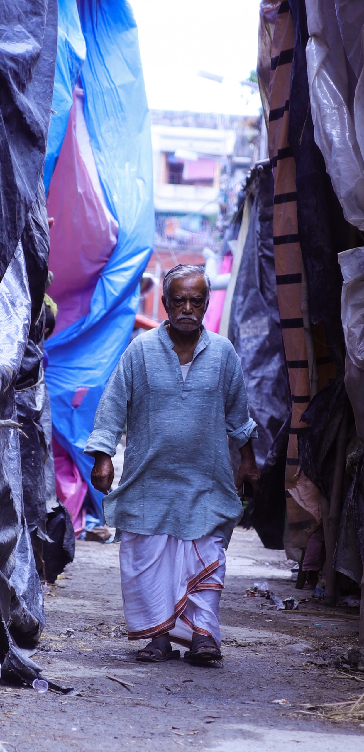 Old Man walking in the street of Kumartuli Kolkata