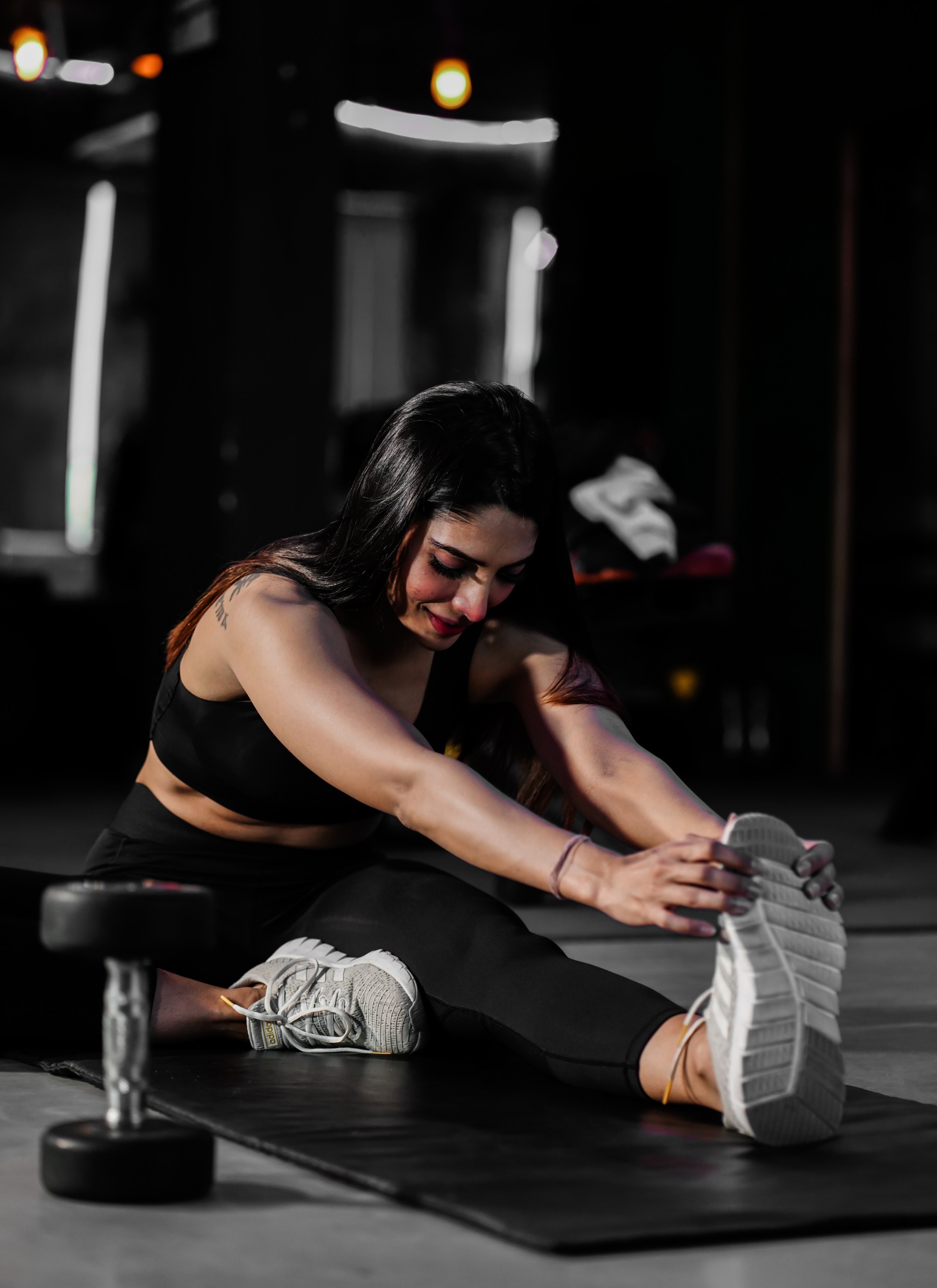 Woman Stretching in the Gym