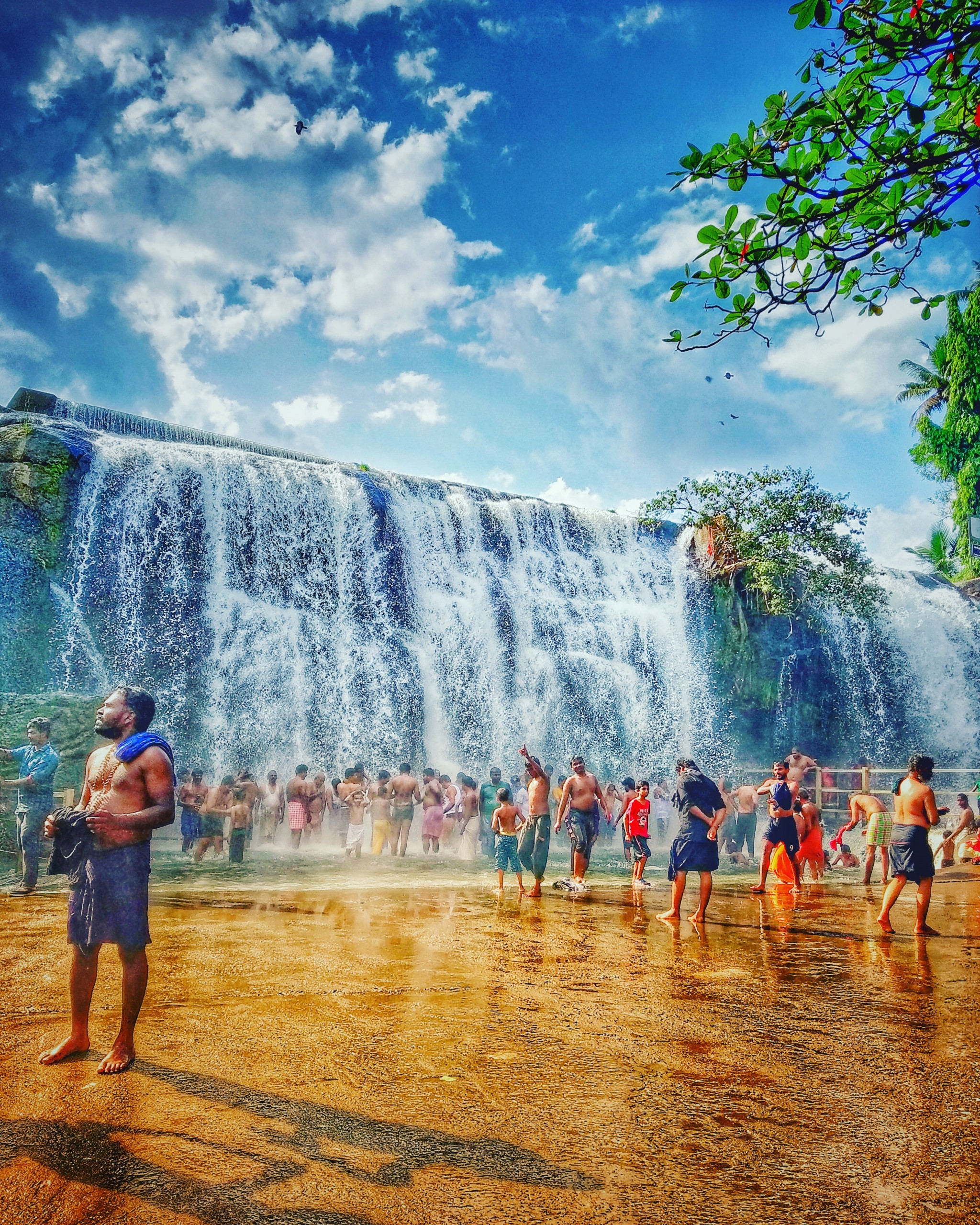 People bathing in the waterfall