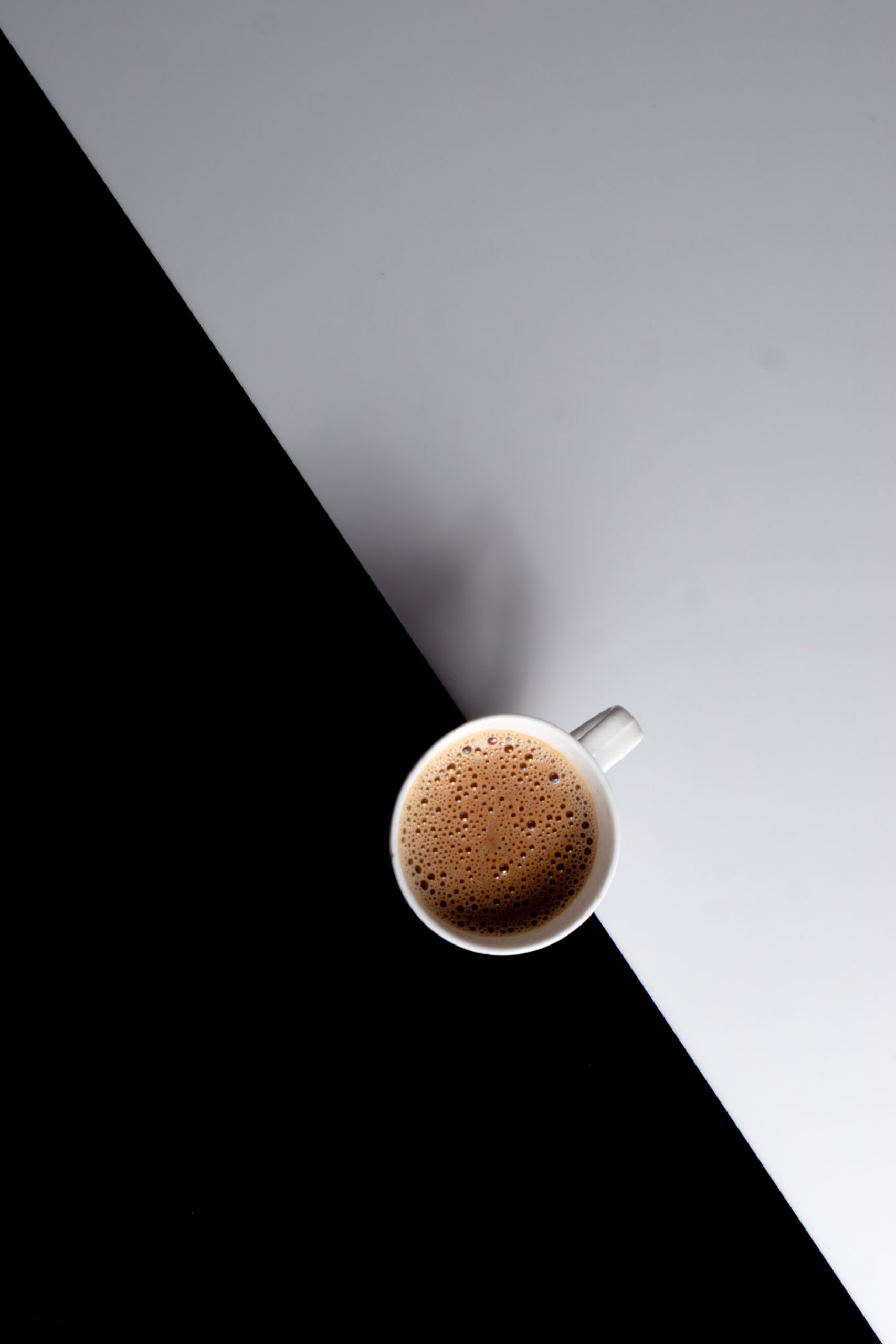 A cup of tea on a black and white background.