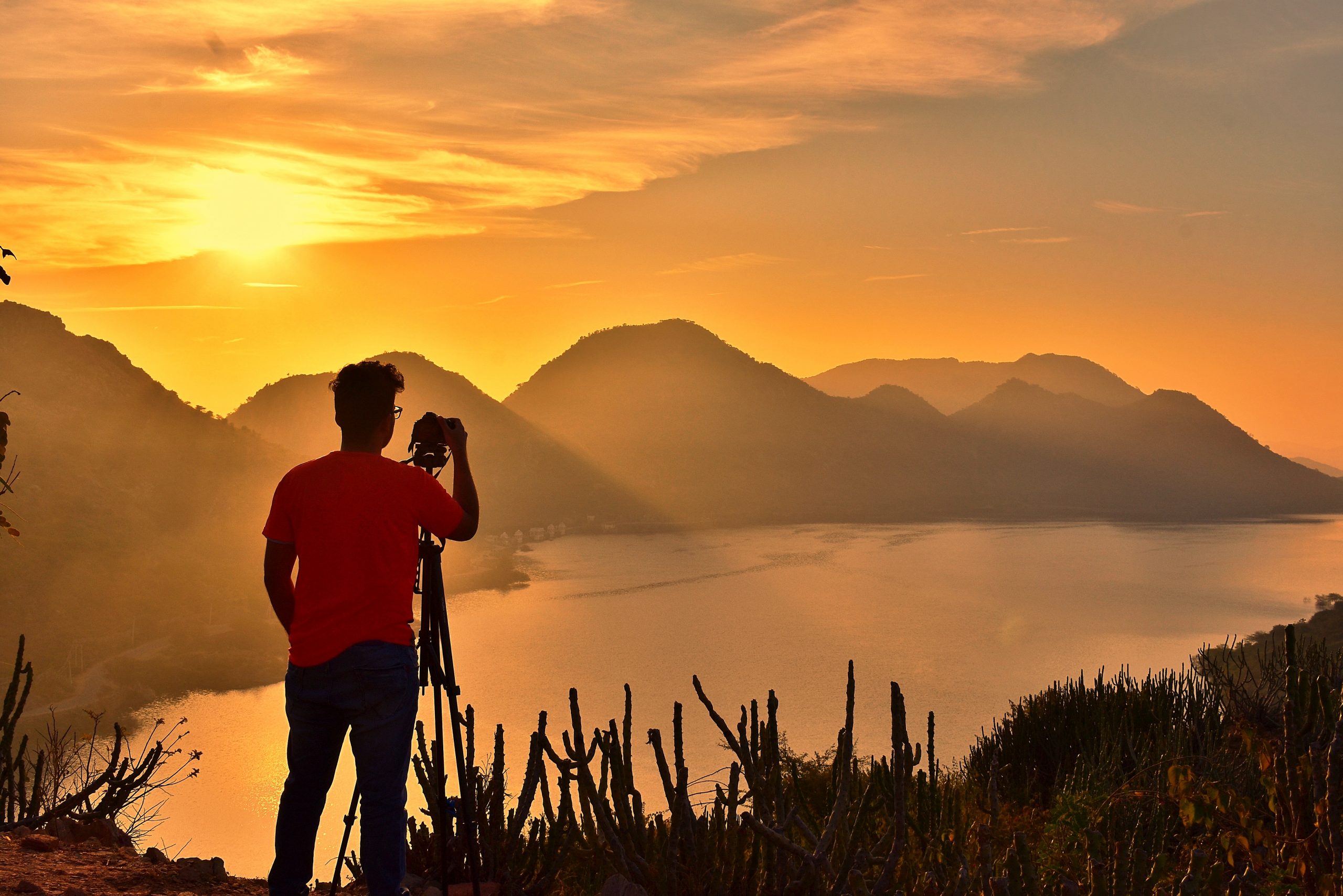 A photographer capturing sunset