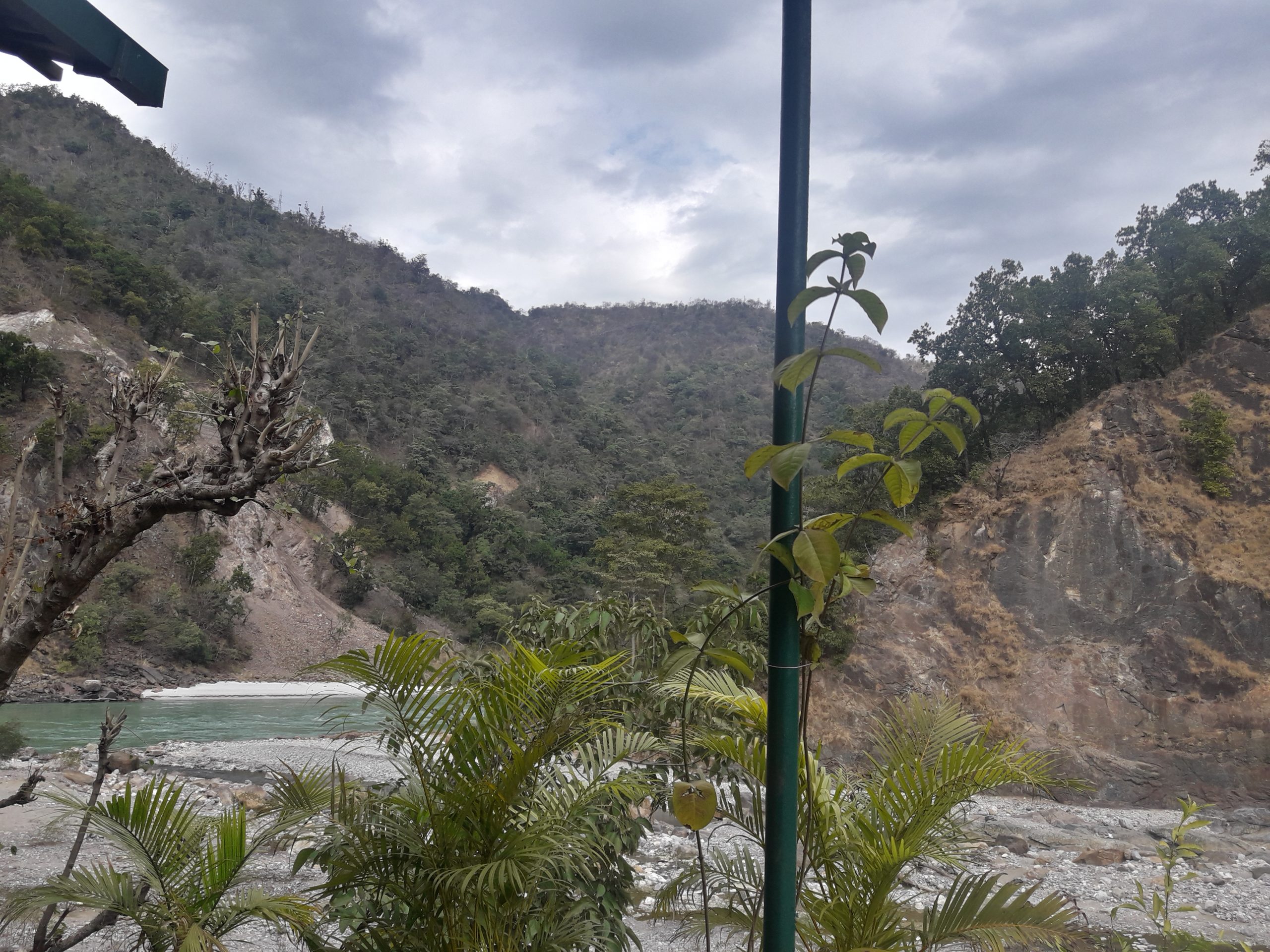 A river flowing through mountains in Rishikesh