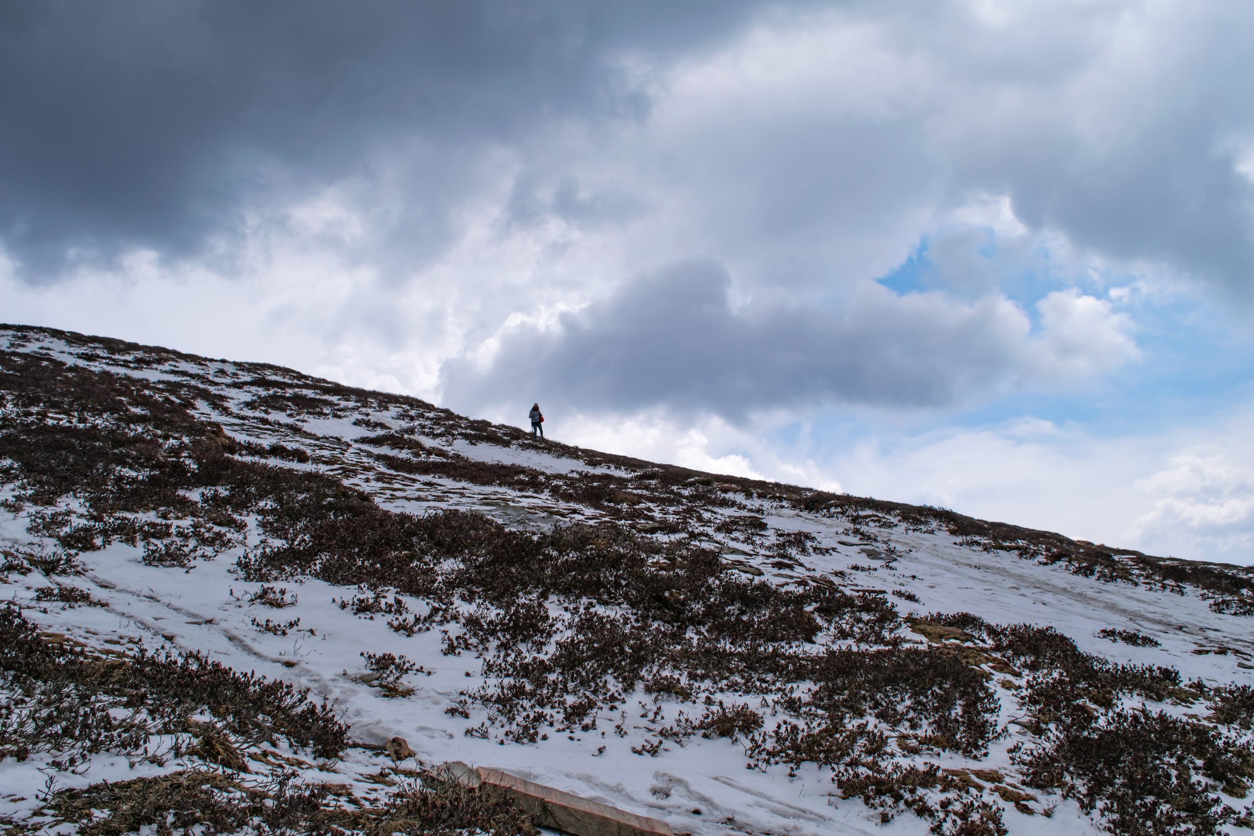 A trekker on a snowy mountain