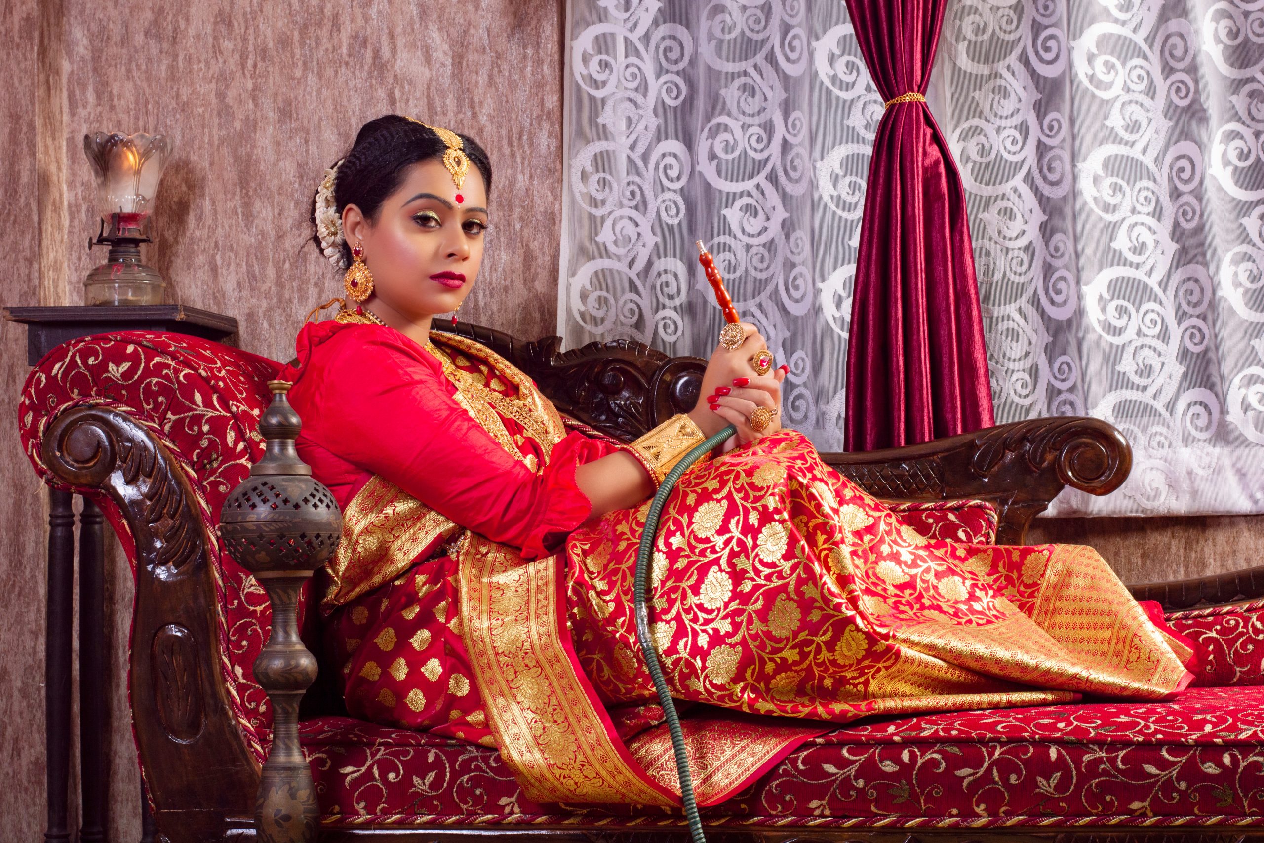 A Bengali woman with hookah pipe