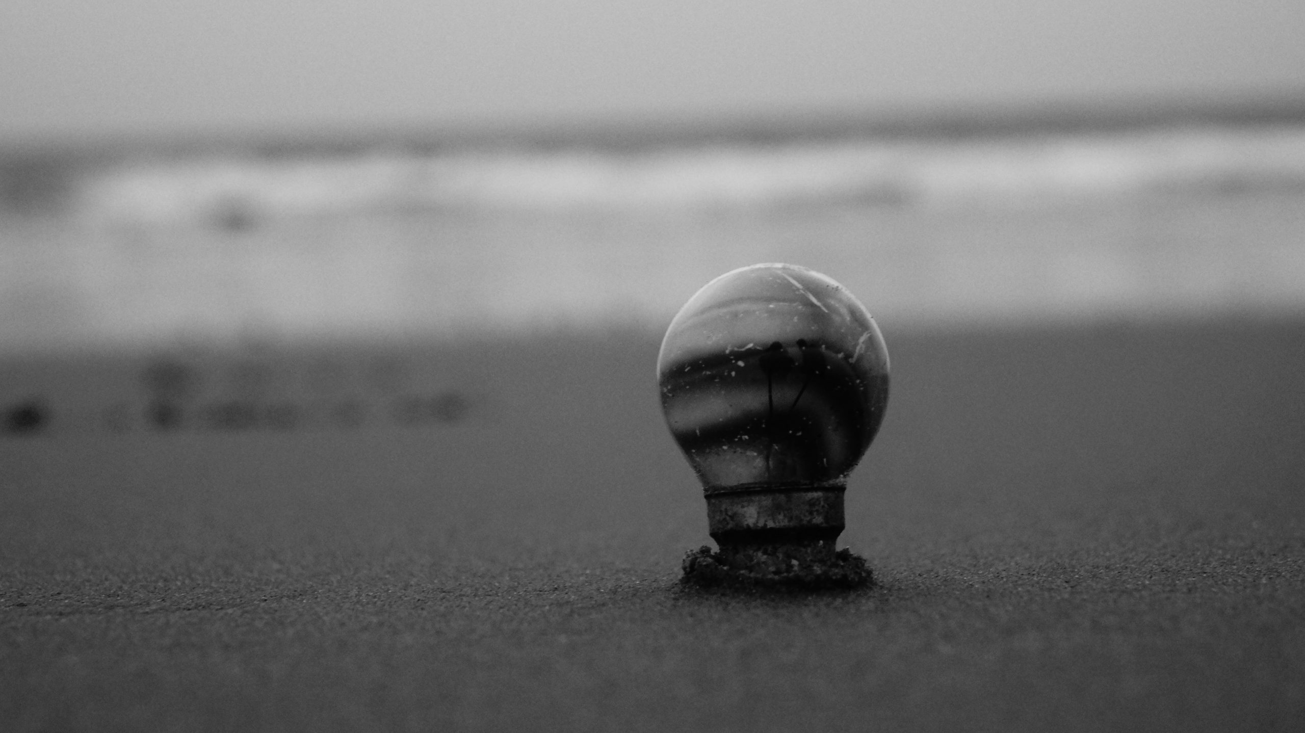 A bulb inserted in beach sand