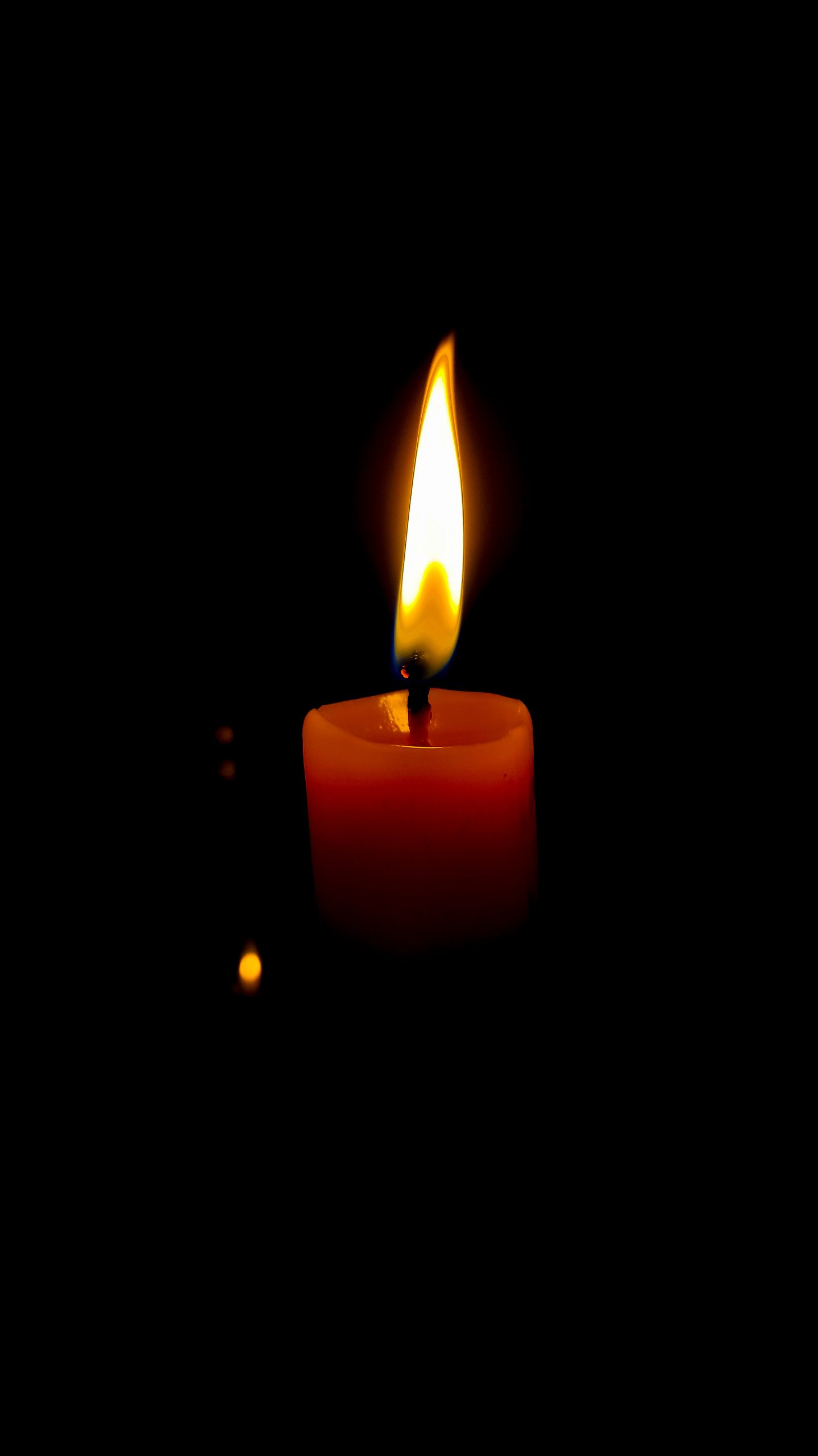 Candle flame on dark background