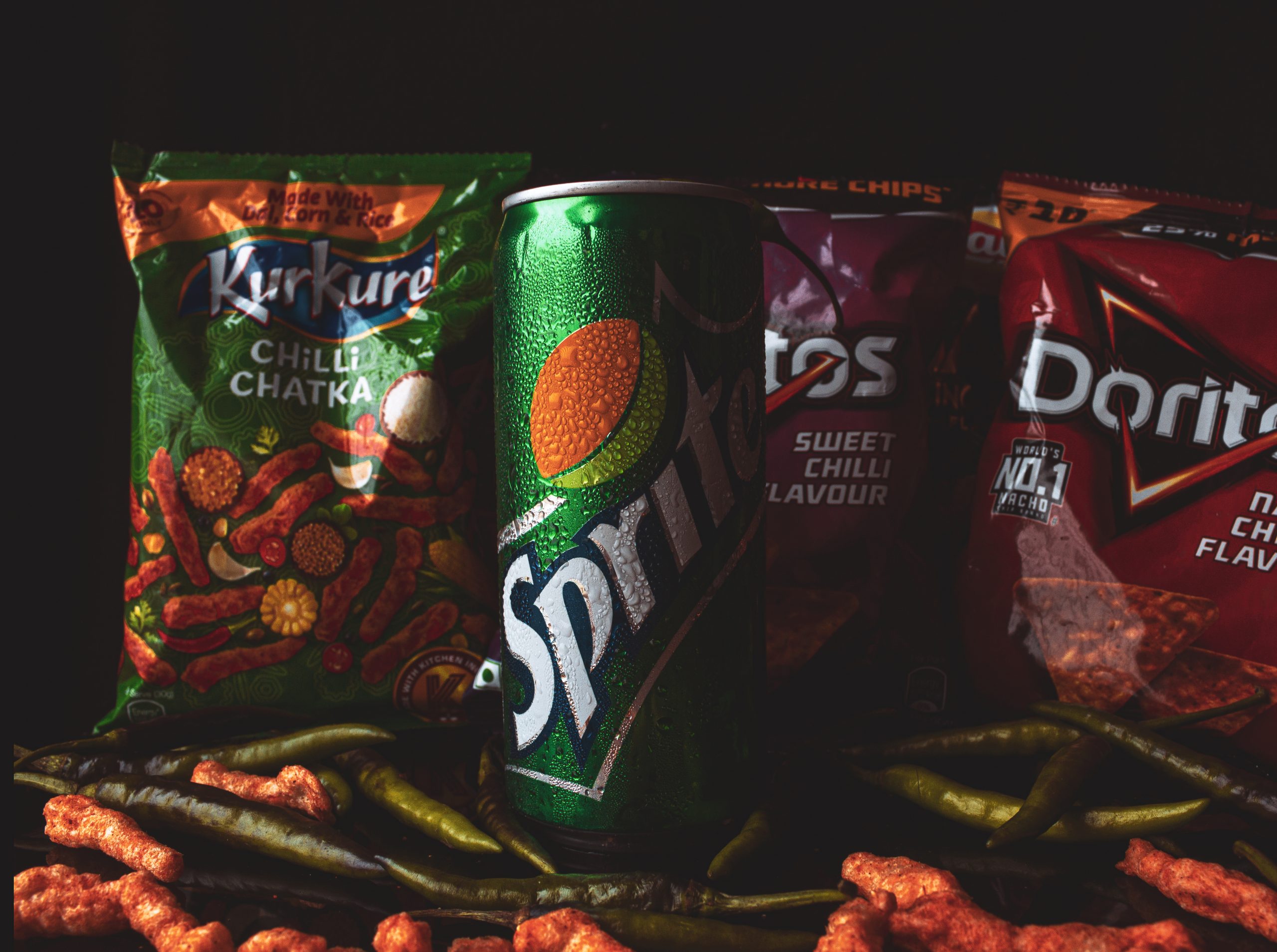 Chips and Soda on Dark Background