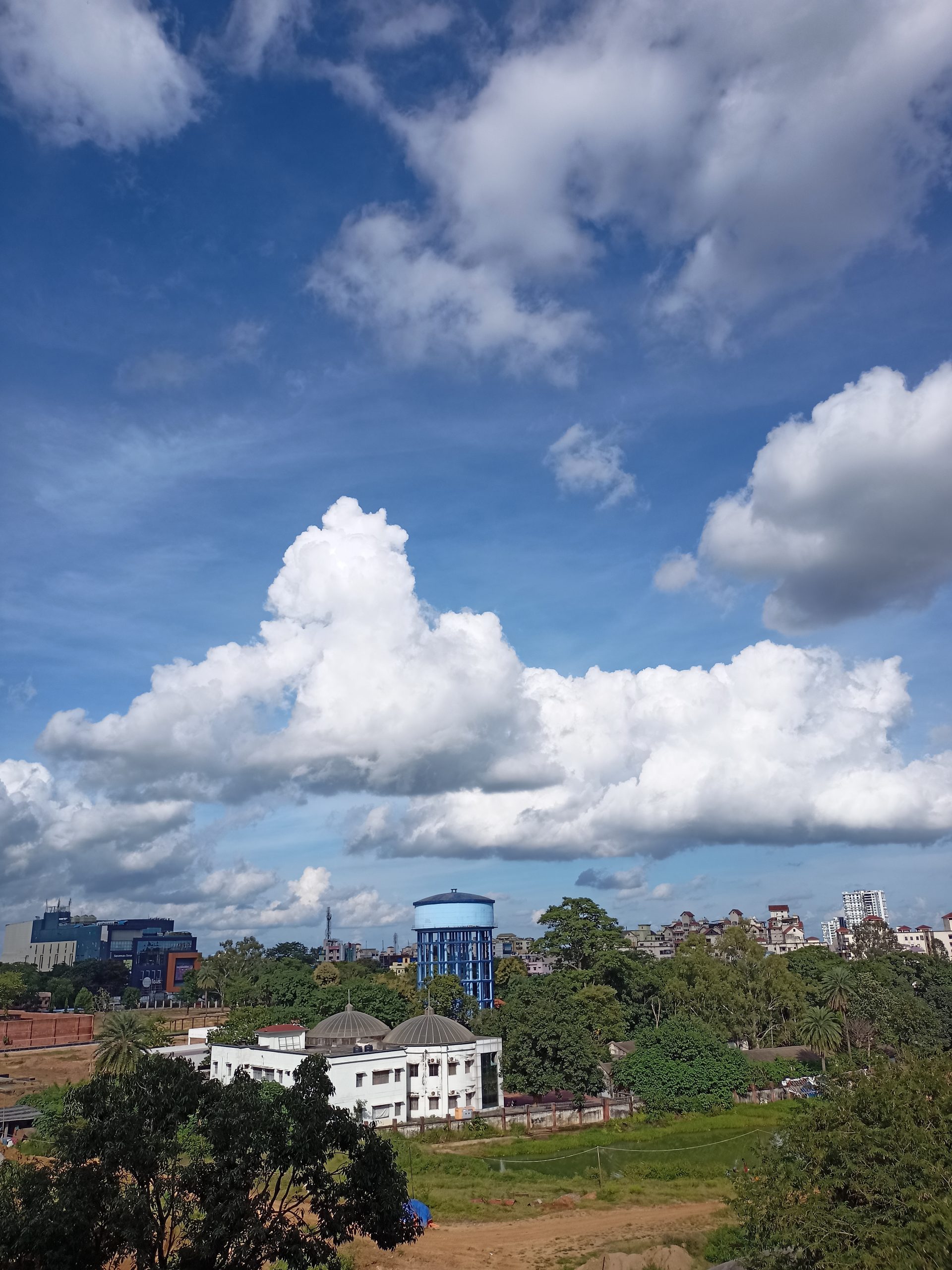 Cumulus clouds over a city