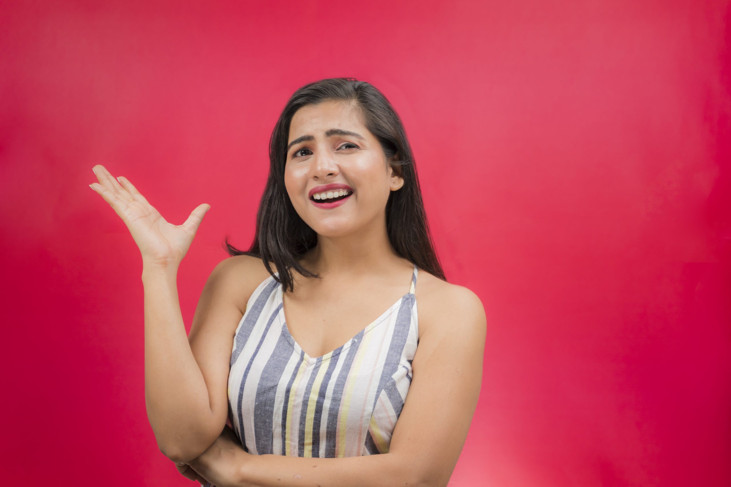Excited indian girl pointing hand