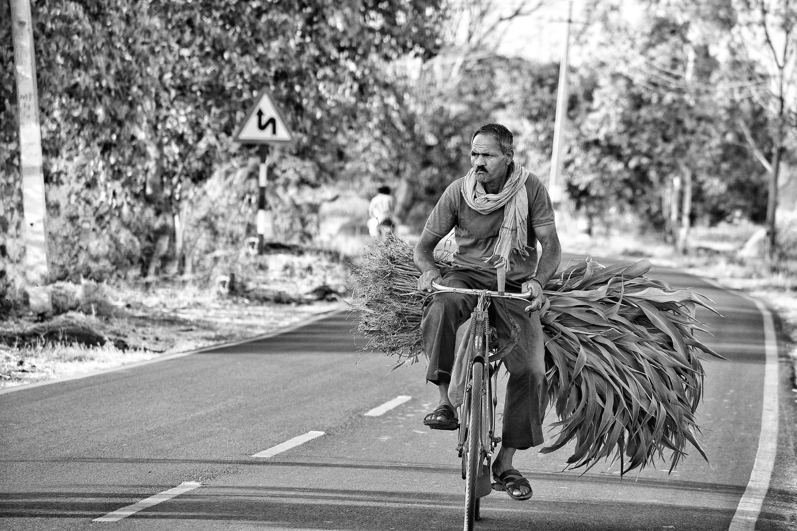 Farmer in his Bike on Black and White