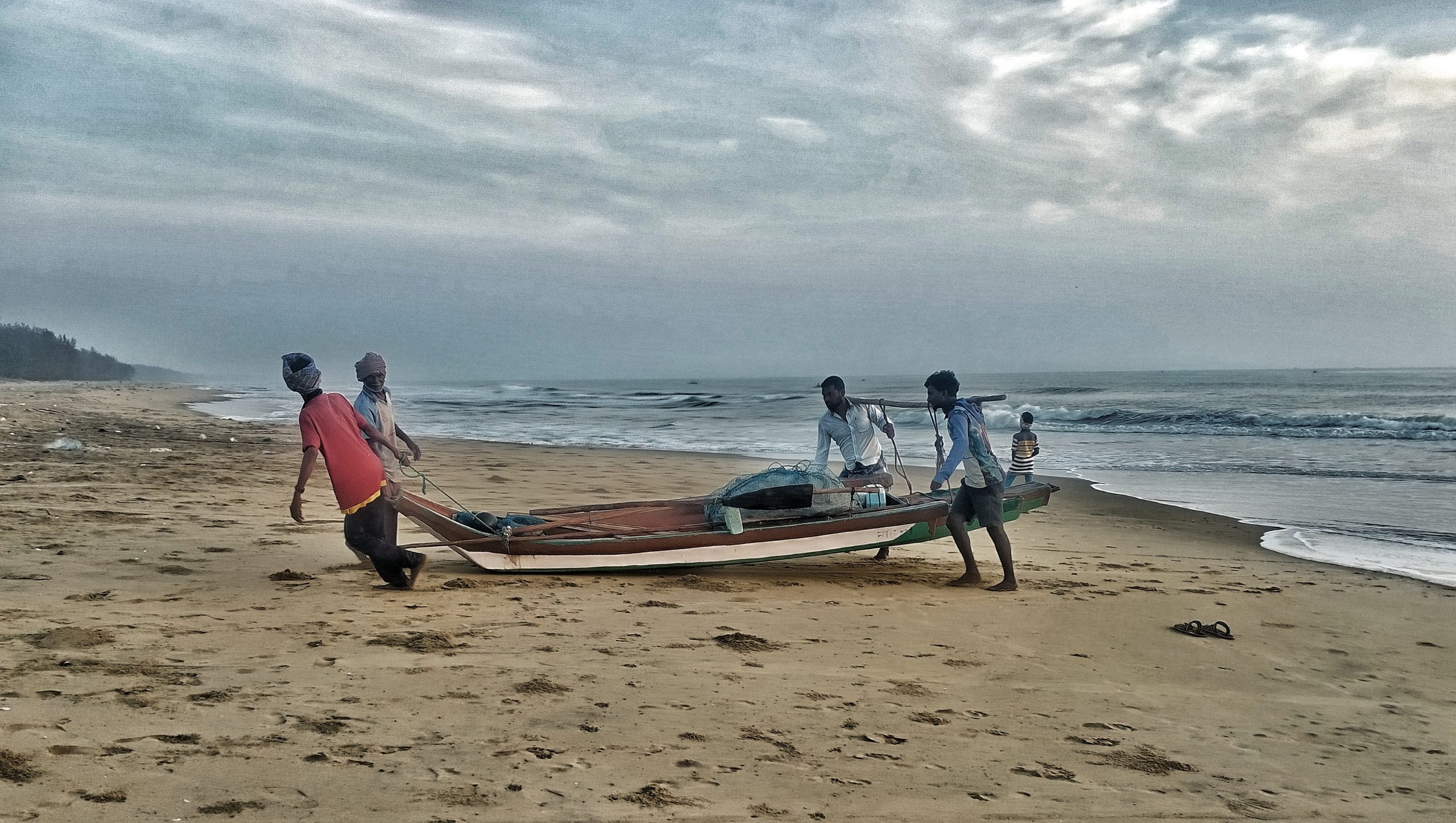 Fishermen on a beach