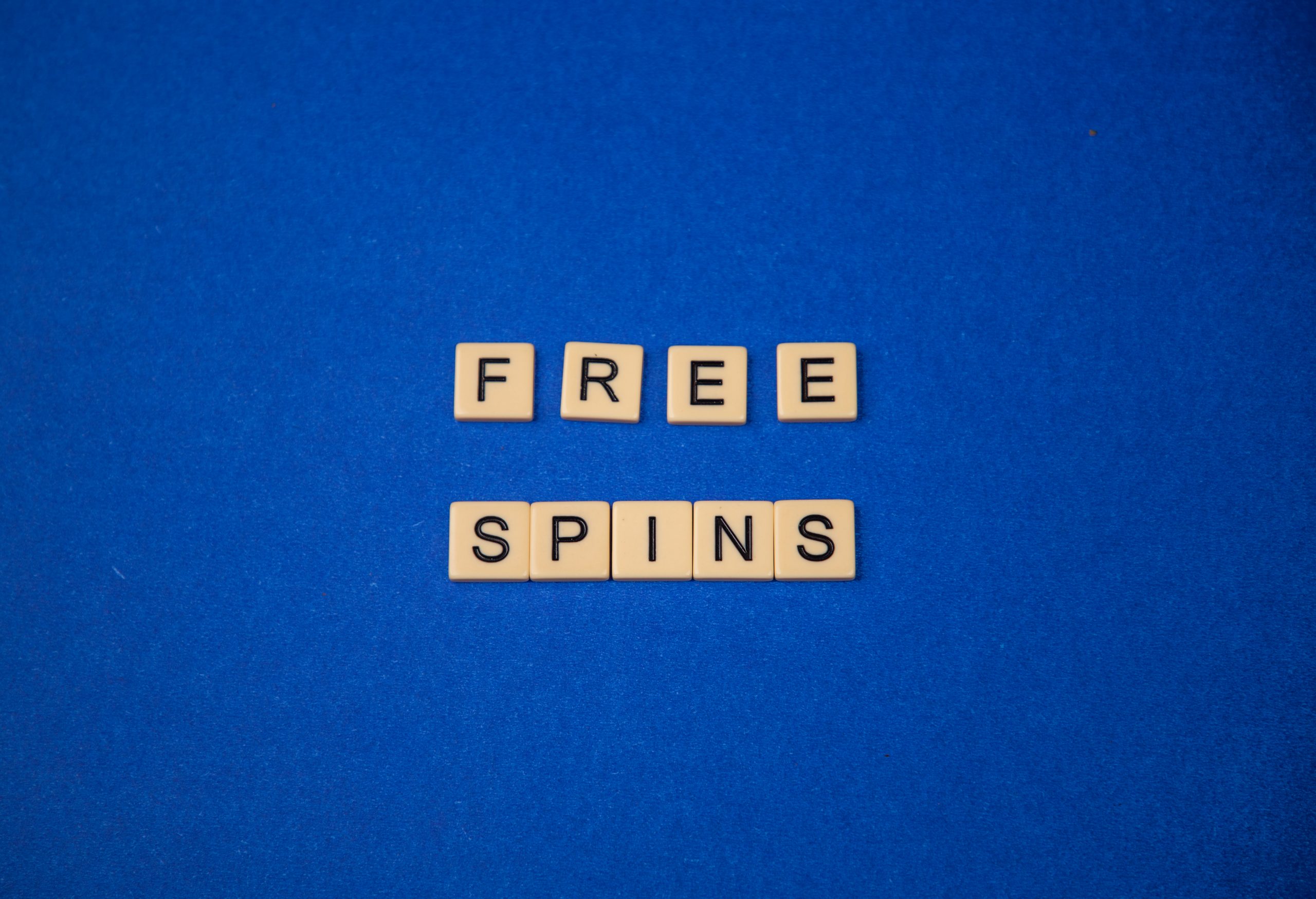 Free spins written using scrabble tiles