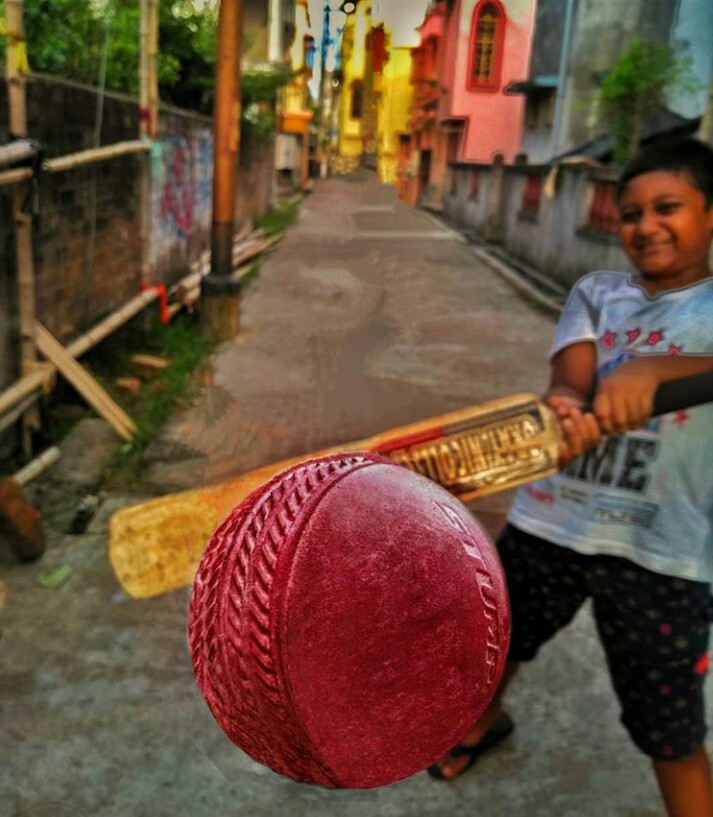 Boy playing Galli cricket