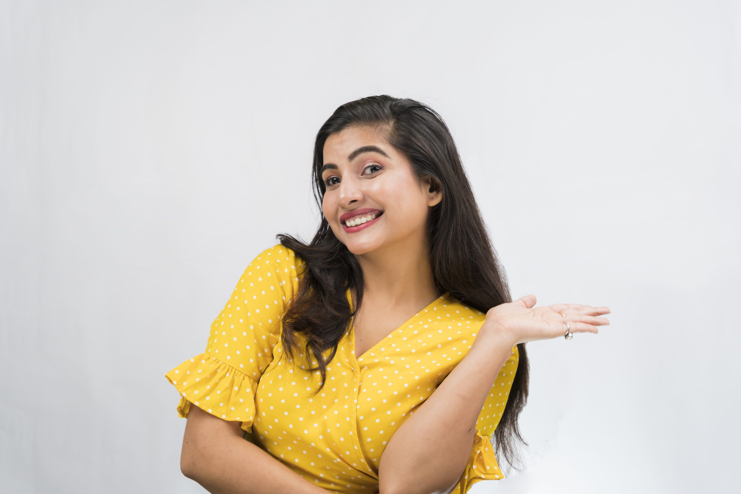 Happy indian girl showing hand