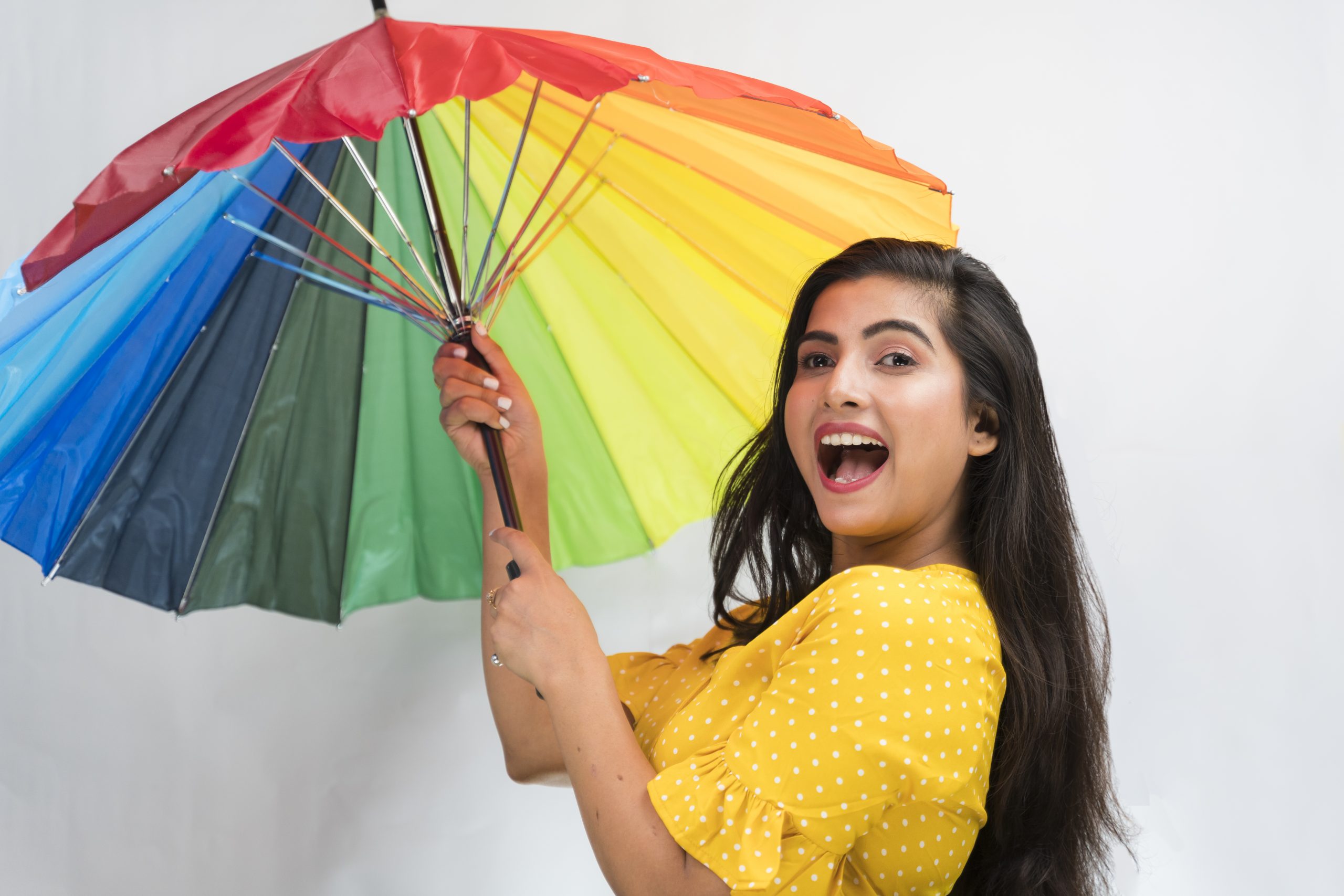 Happy indian girl with umbrella
