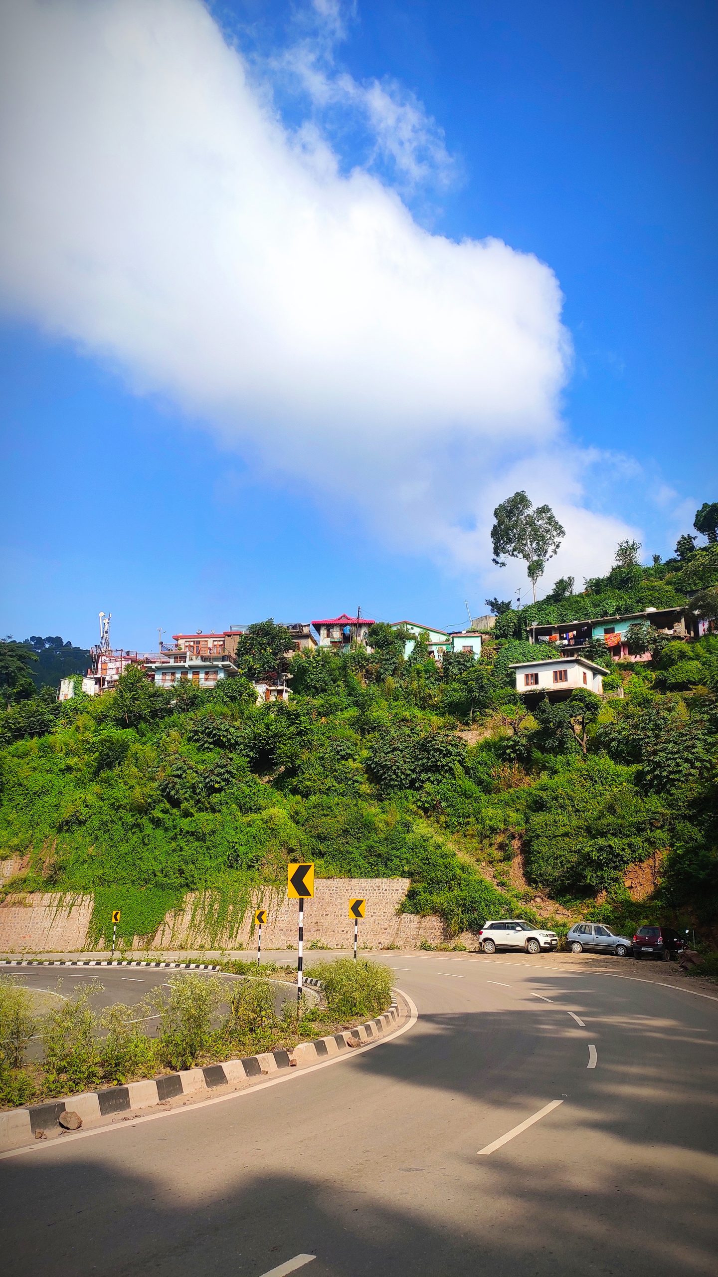 Houses at a hilly highway