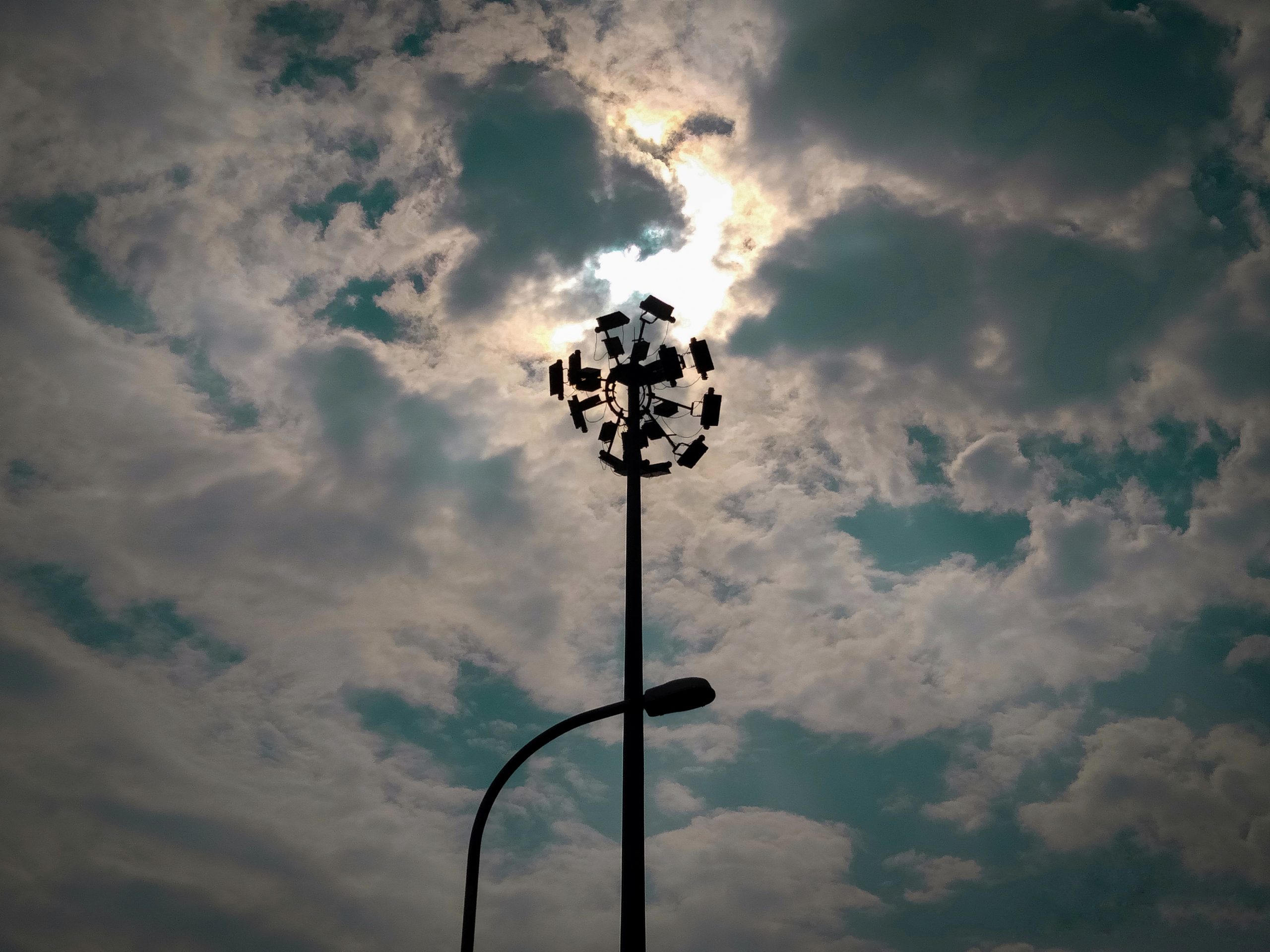 Light Pole In Cloudy sky