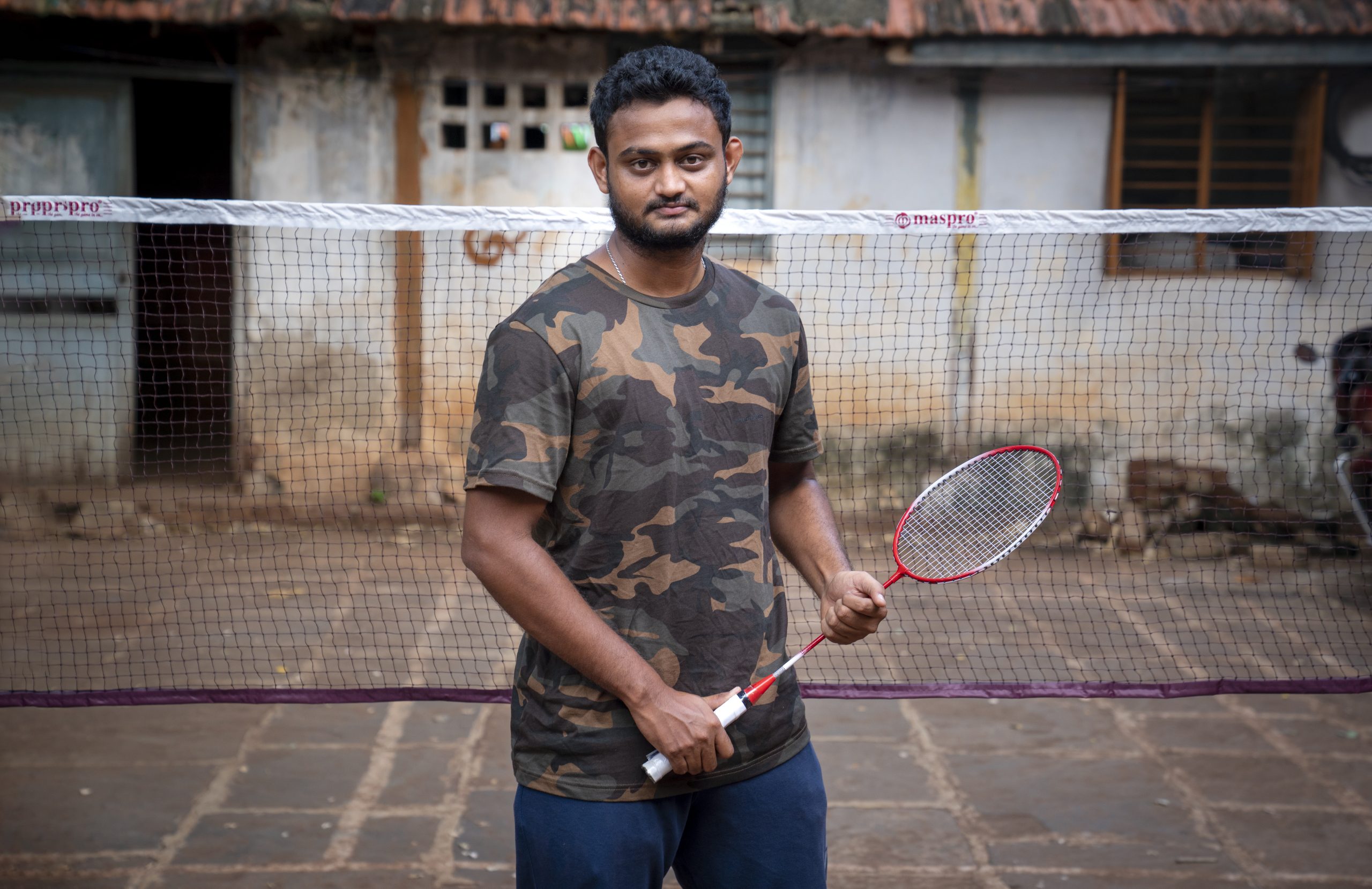 Man holding a badminton racket