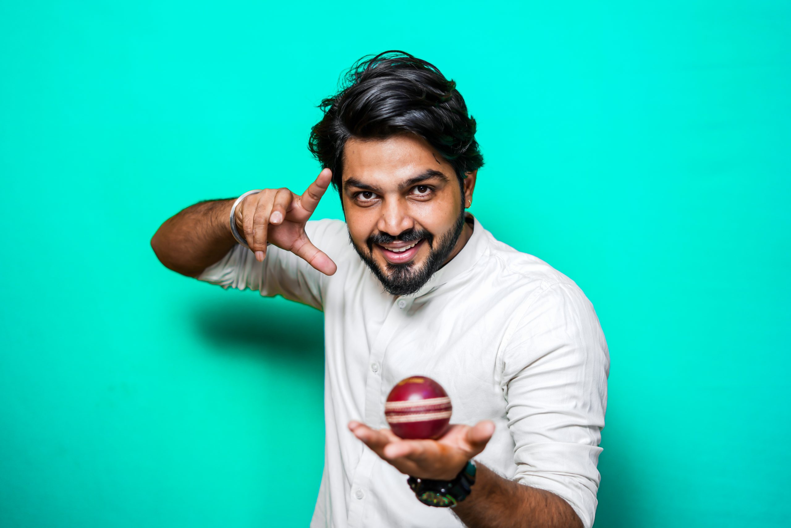 Man holding a cricket ball