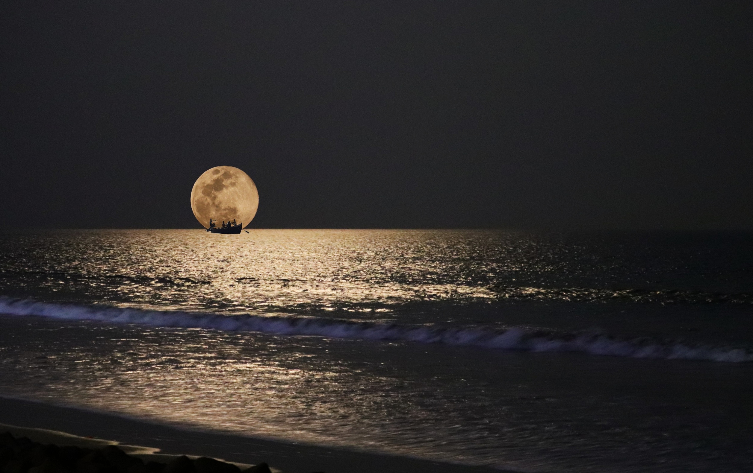 Moon touching the sea