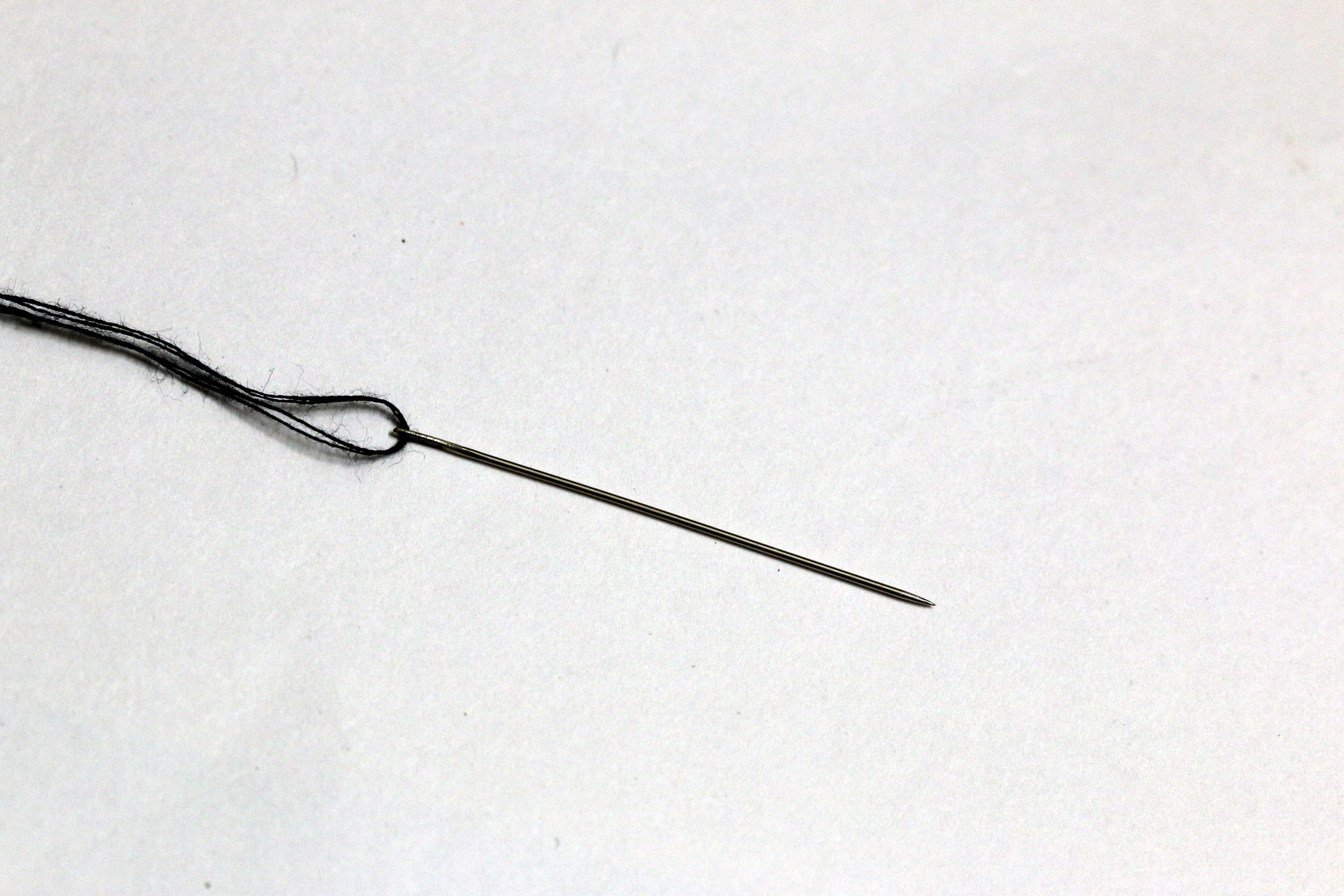 Needle with thread