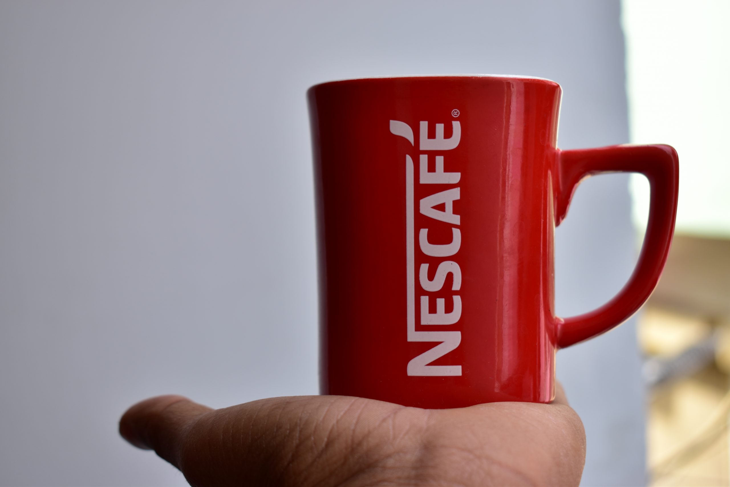 Nescafe Mug on Hand