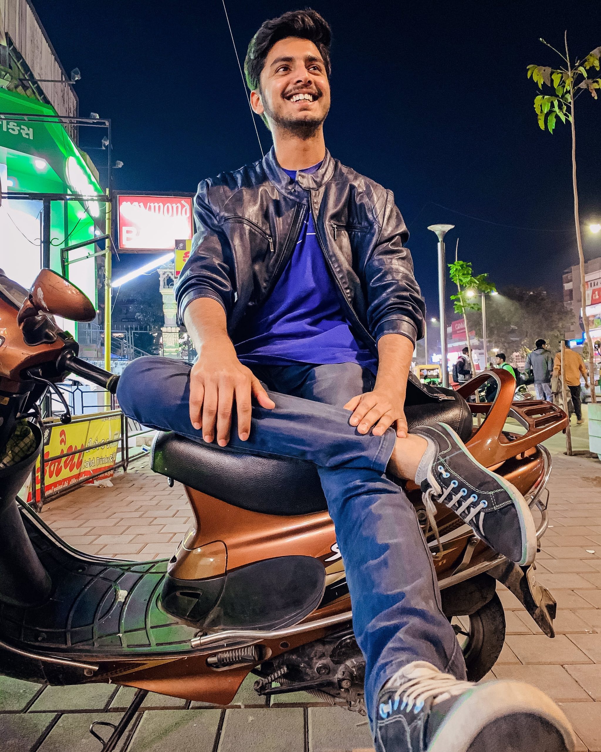 Man sitting on a scooter