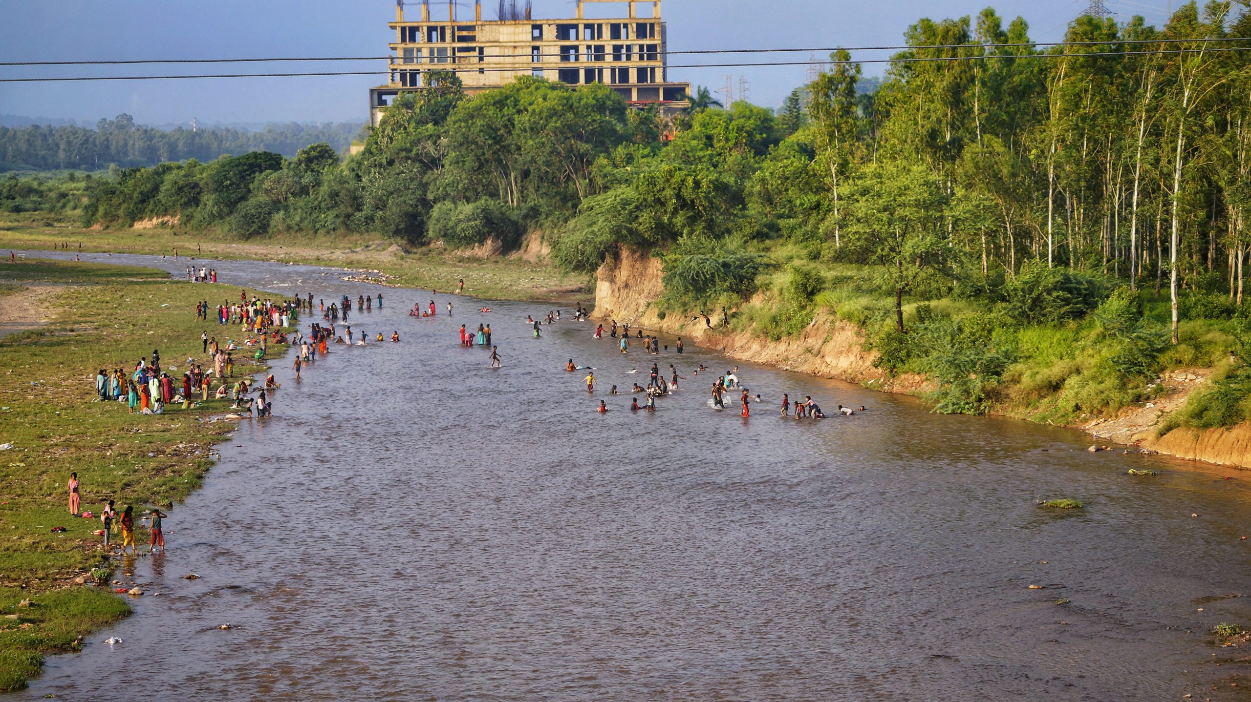 People taking bath at river