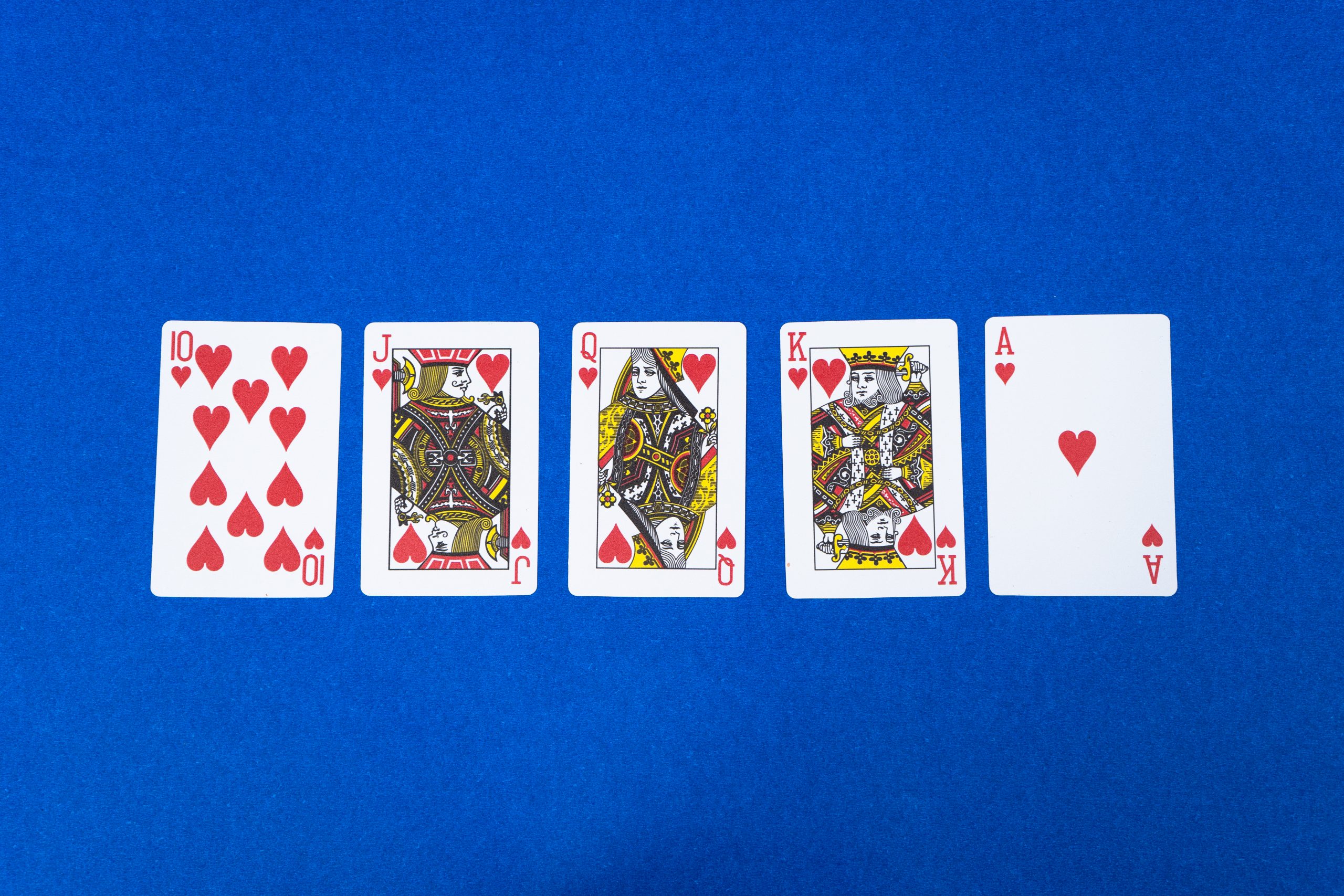 Poker Royal Flush Flatlay on Blue Background
