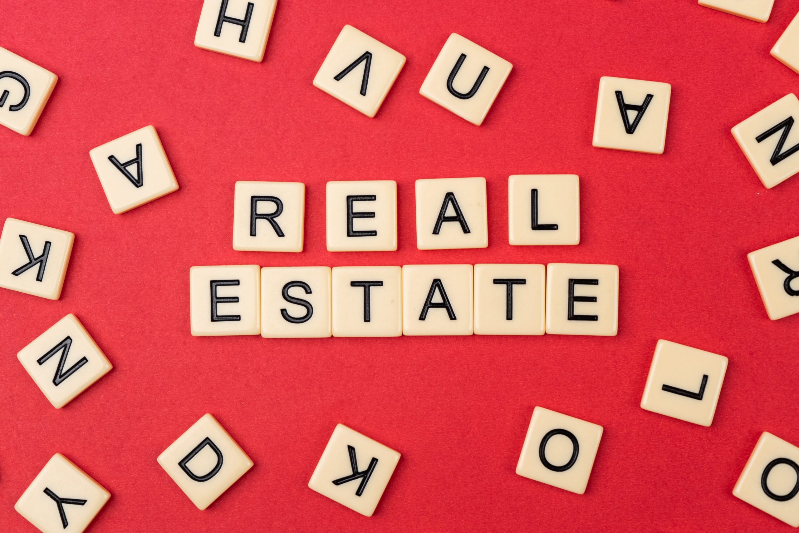 Real estate written on scrabble