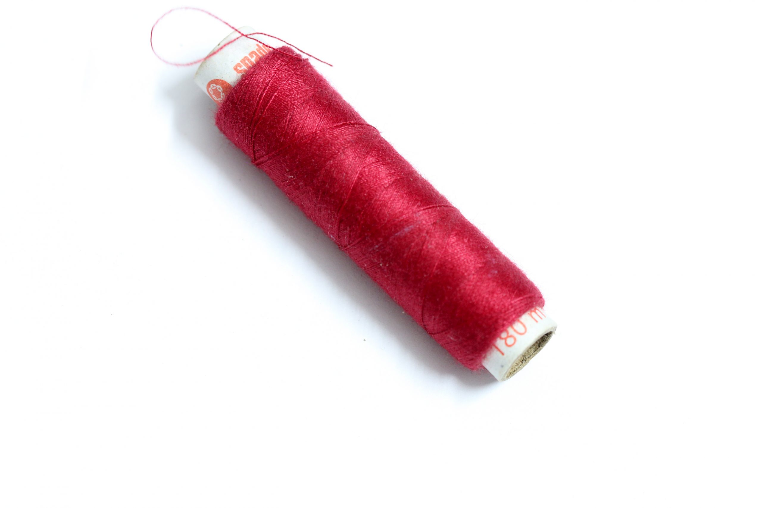 Red sewing thread reel