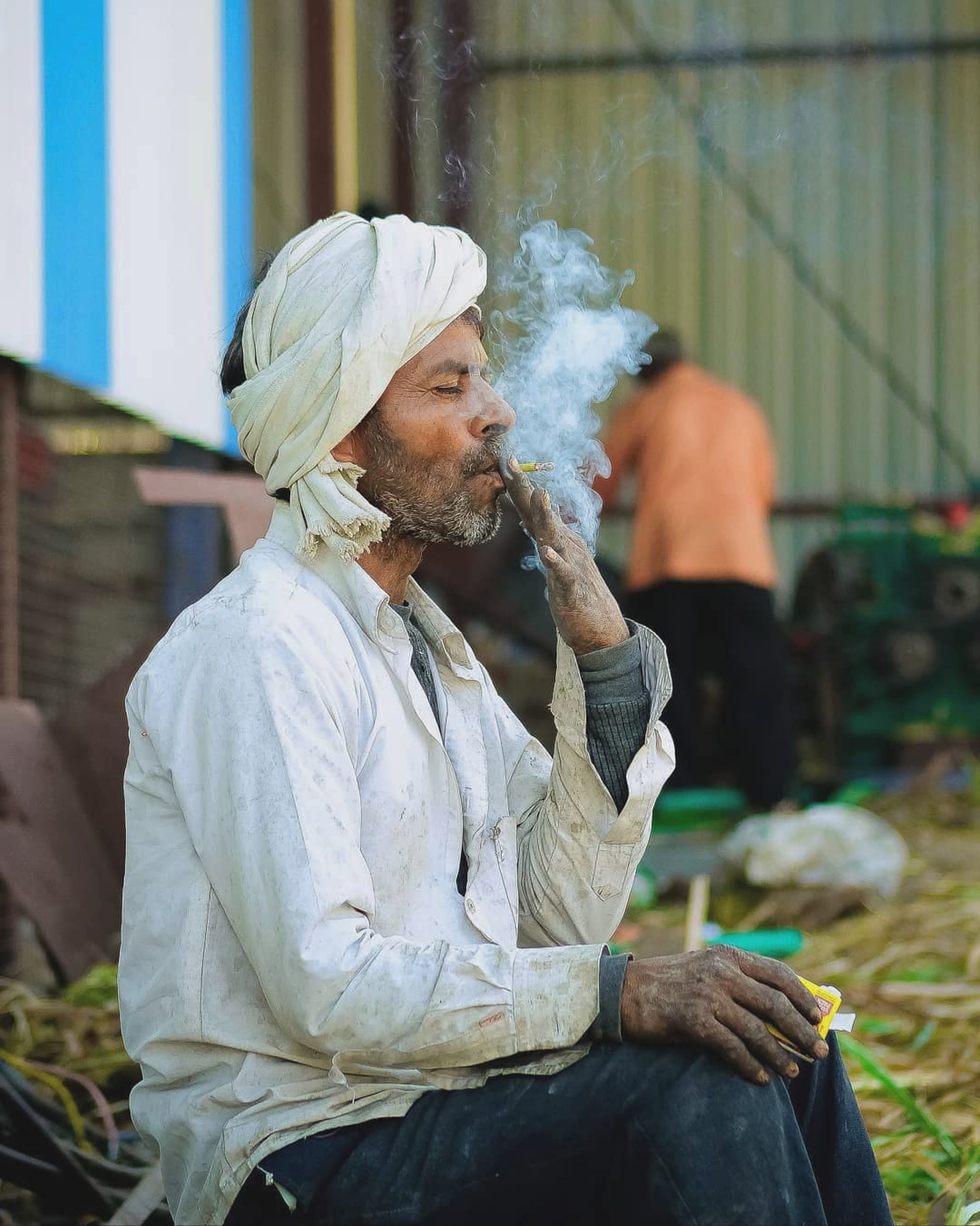 A man smoking cigarettes.