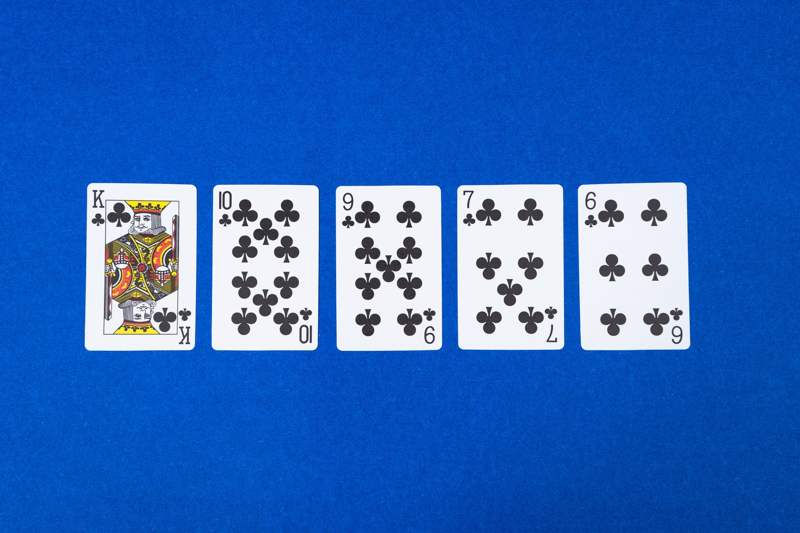 Straight flush Poker on Blue Background