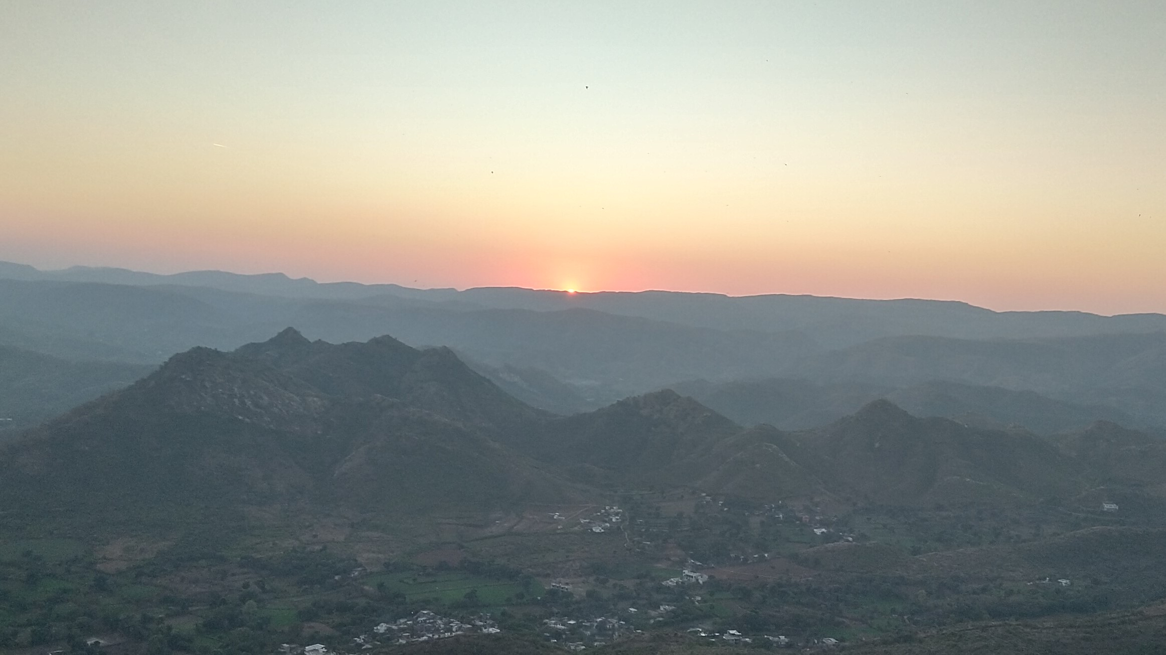 Sunset through mountains