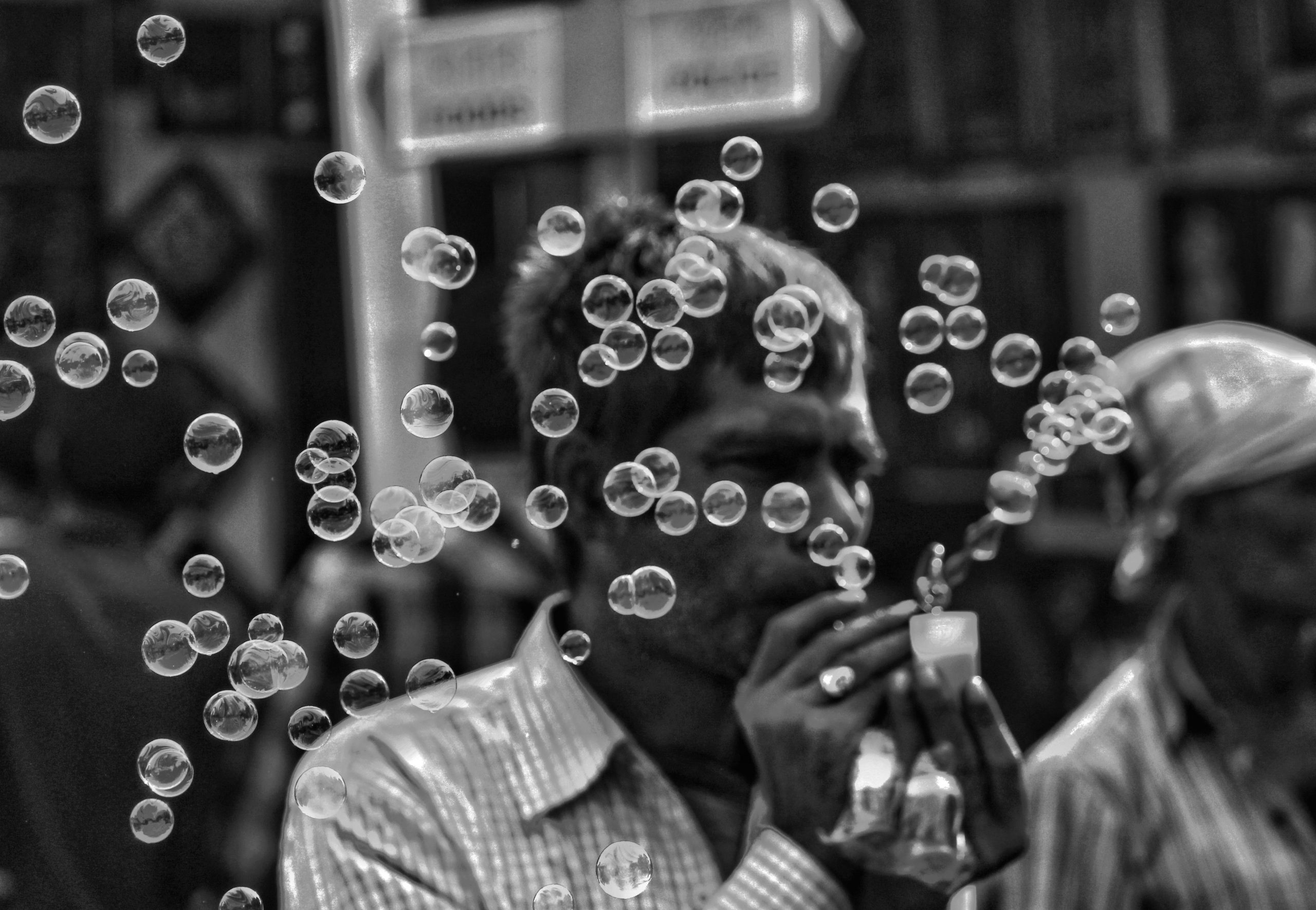 Man Playing Bubbles Black-and-White