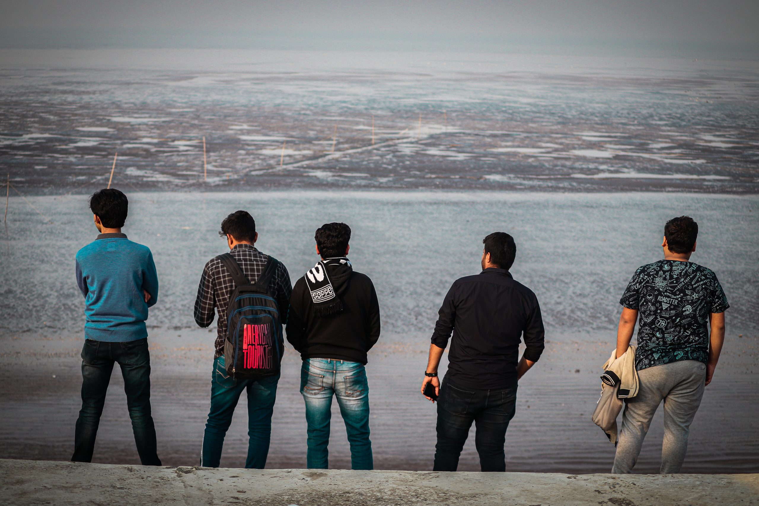 Boys standing at Tithal Beach
