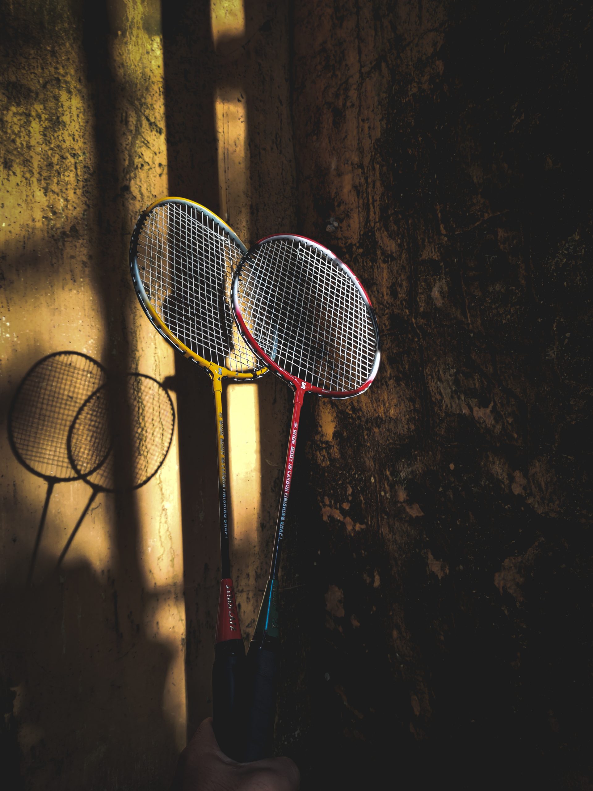 Two badminton rackets