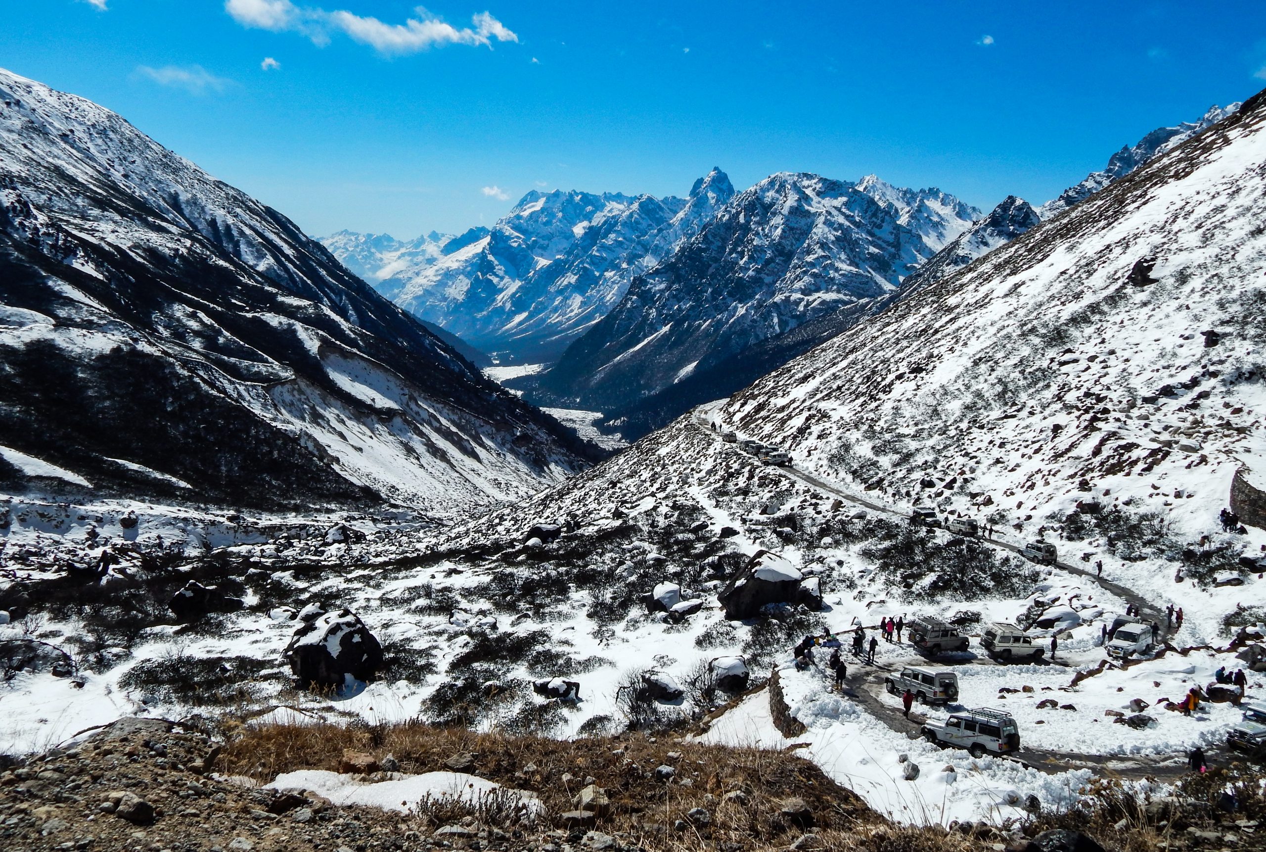 People traveling through roads in mountains