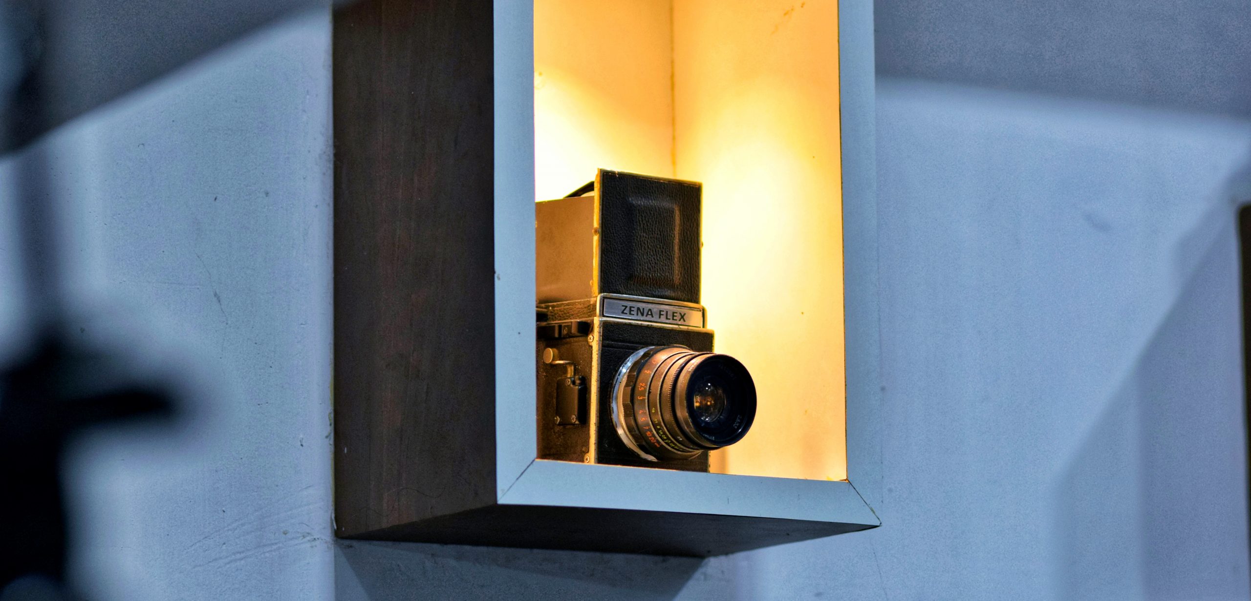 A vintage camera placed in a room